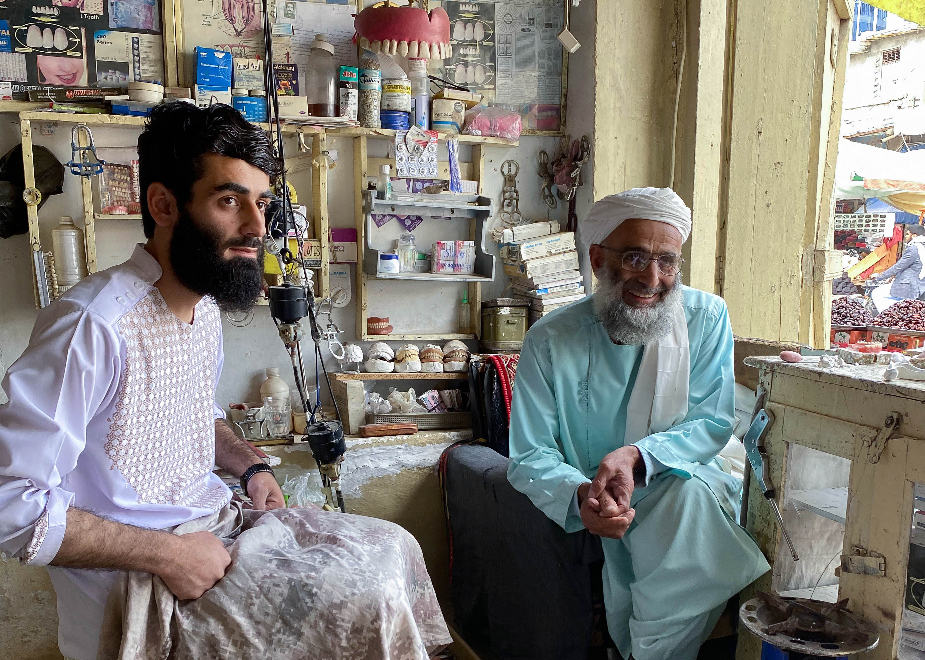 A photo of 65-year-old Haji Muhammad Sultan (right) and his eldest son 23-year-old Ahmed Sayed (left).