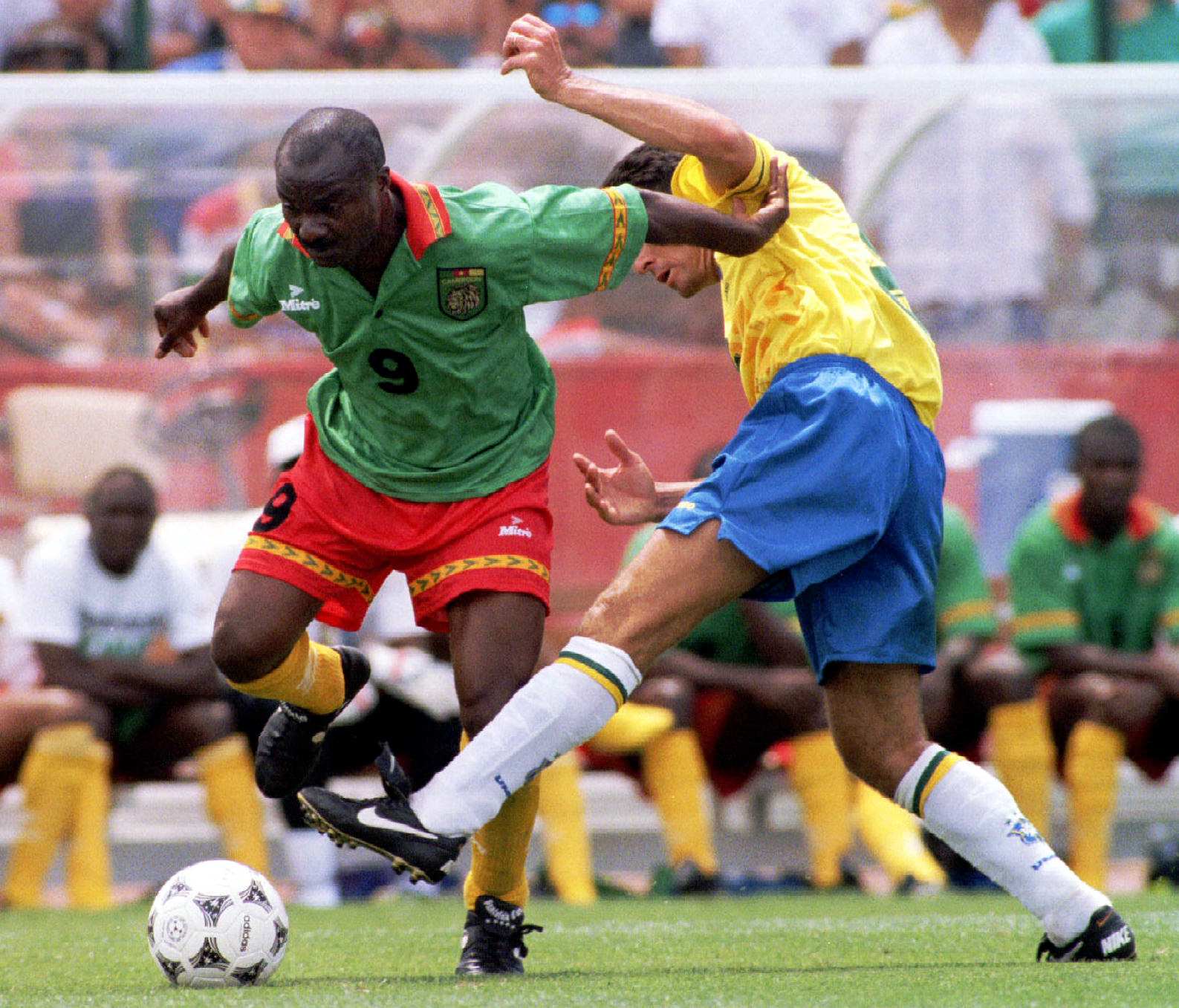 Cameroon's Roger Milla (L)