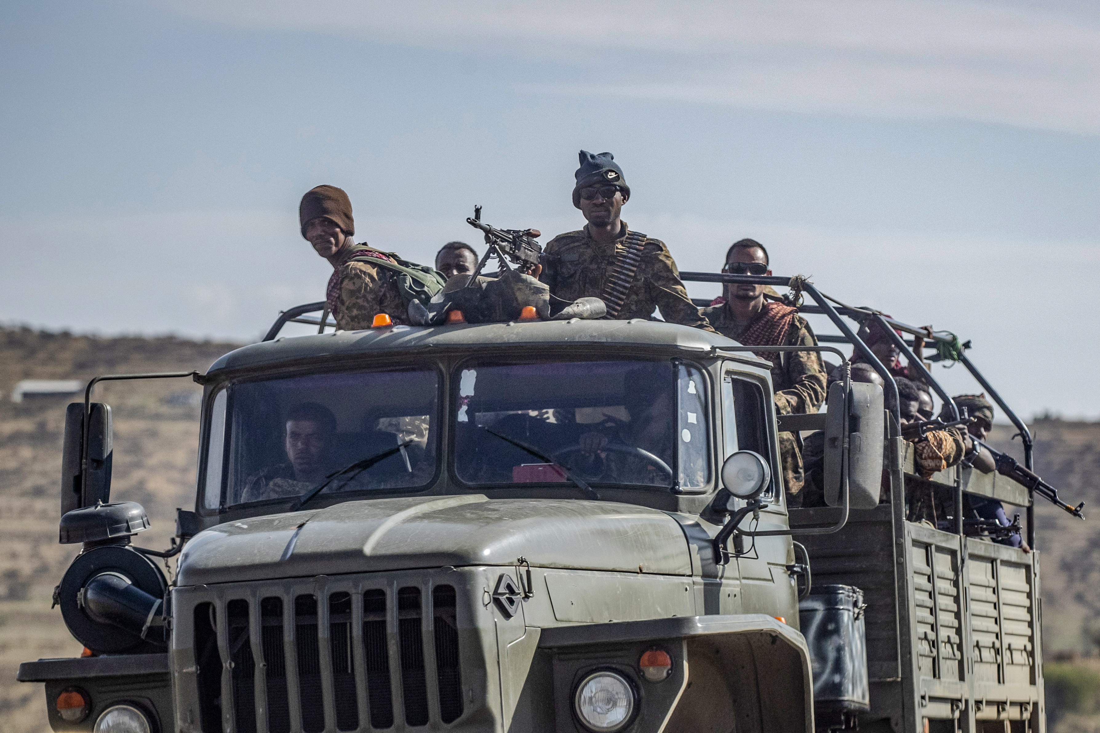 FILE - Ethiopian government soldiers ride in the back of a truck on a road near Agula, north of Mekele, in the Tigray region of northern Ethiopia