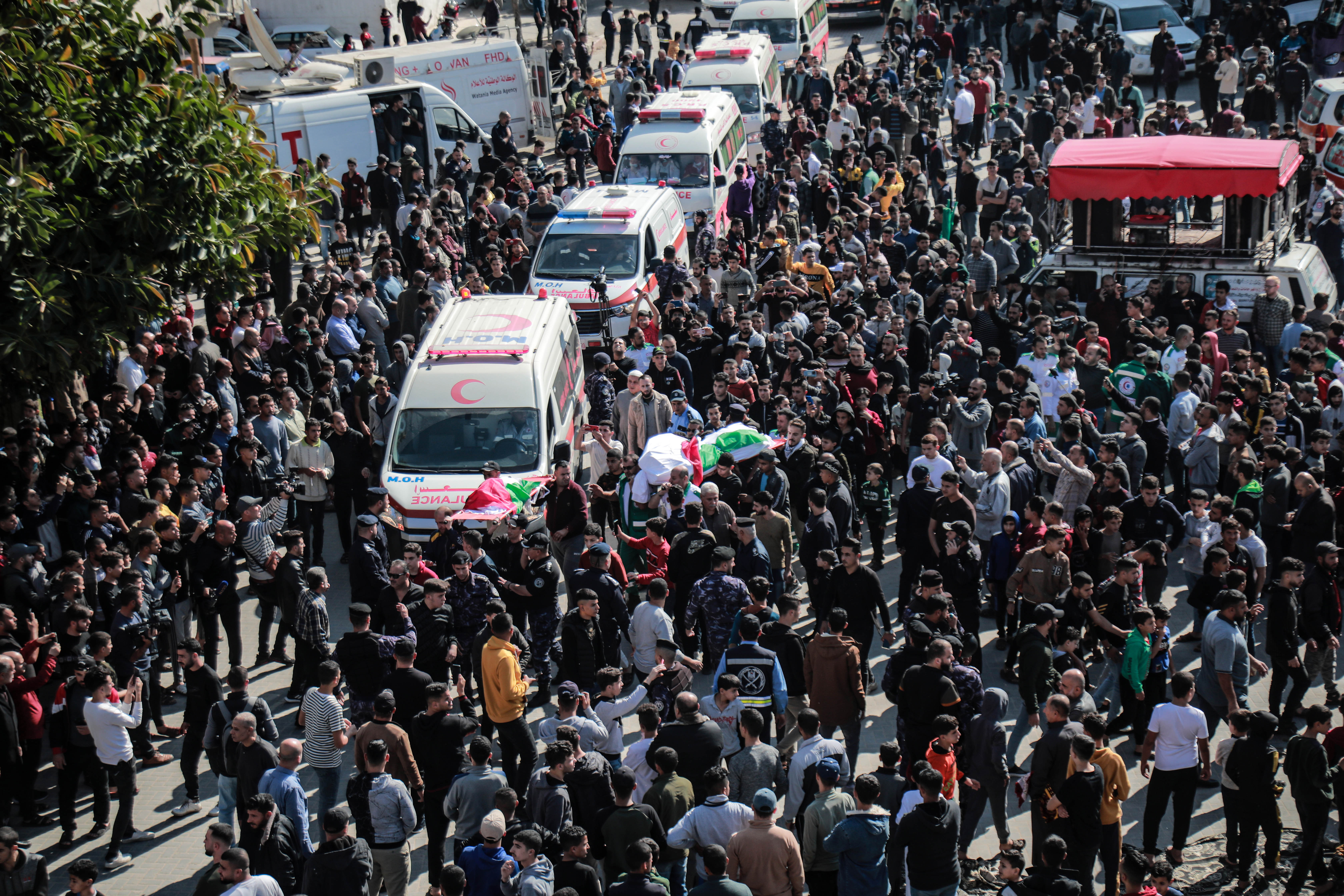 Ambulances in a mass funeral 