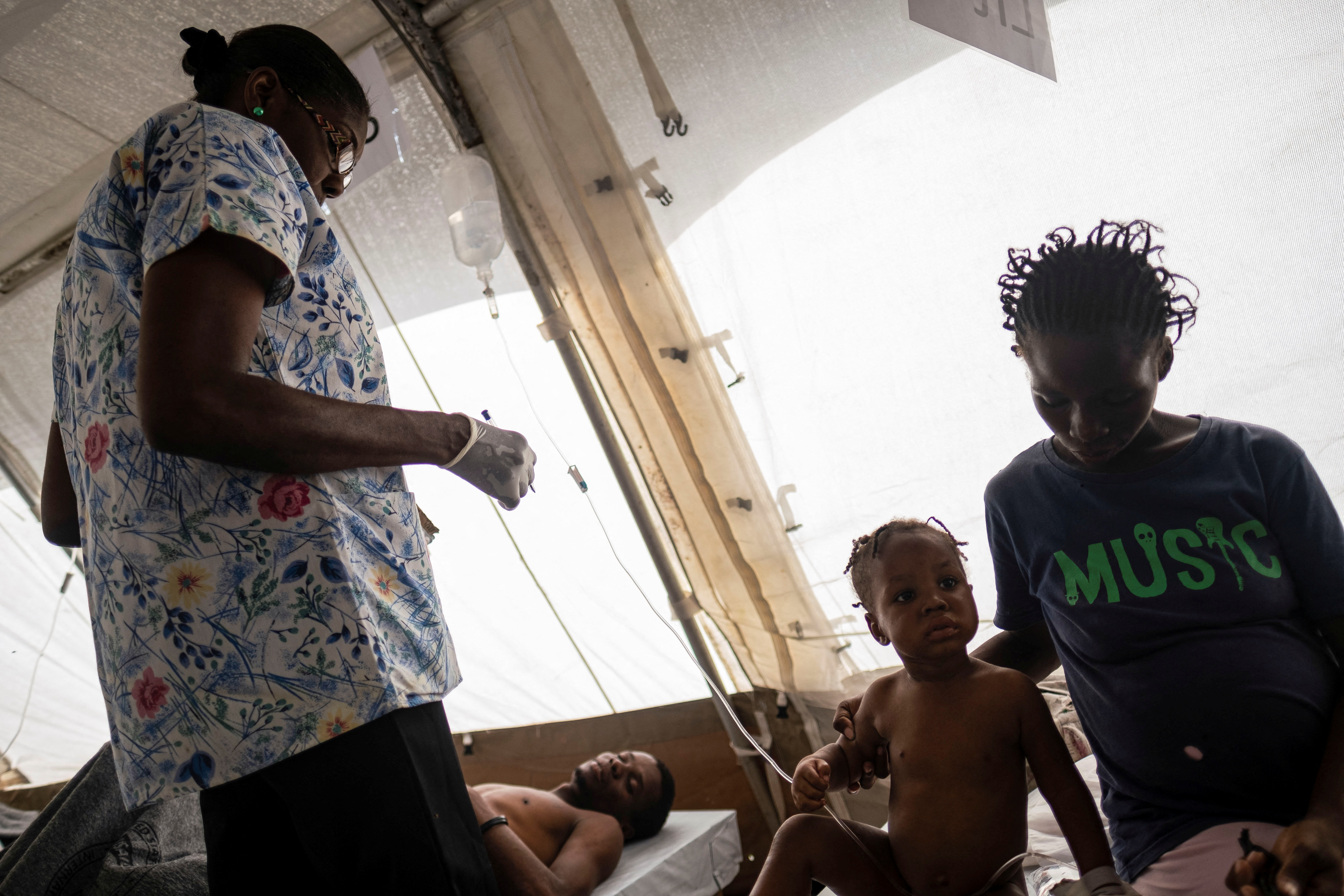 People receive treatment for cholera