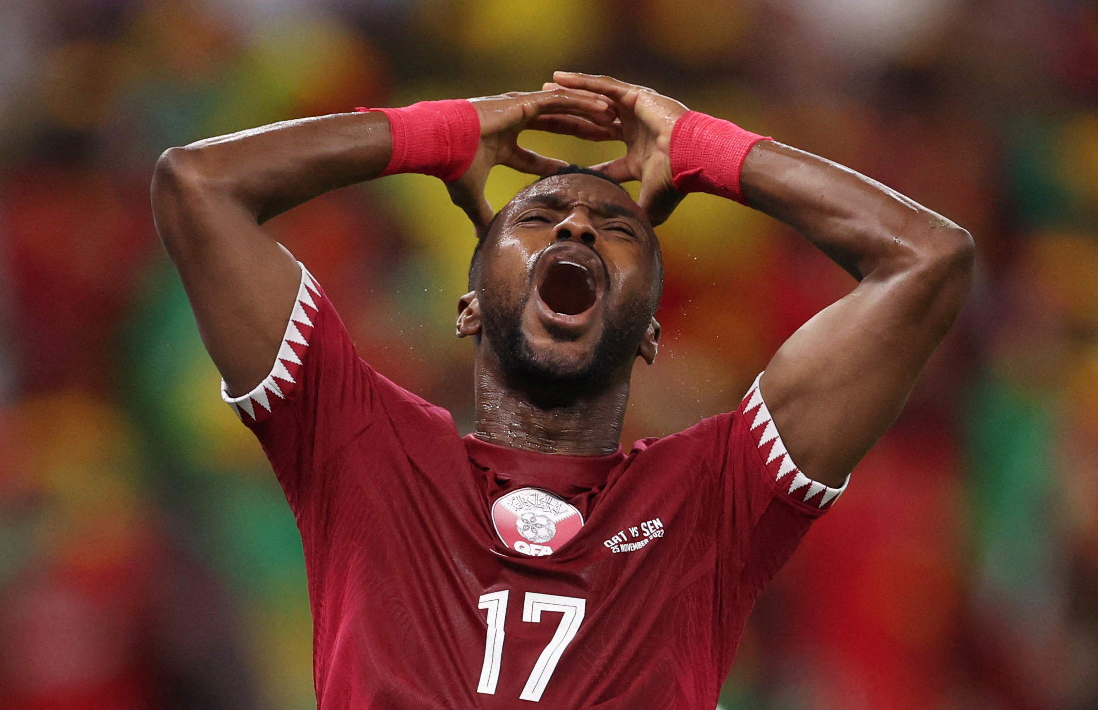Ismail Mohamad has his hands on his head as he looks up with mouth open in devastation
