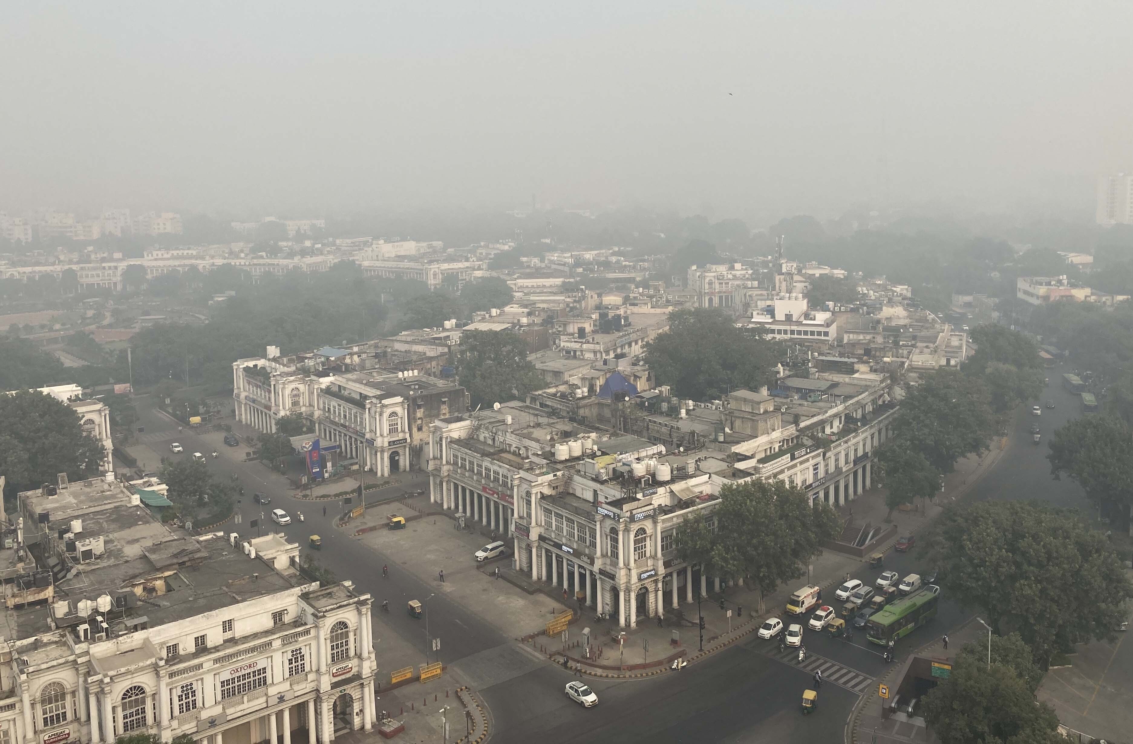 The city horizon is seen enveloped by smog and haze in New Delhi.