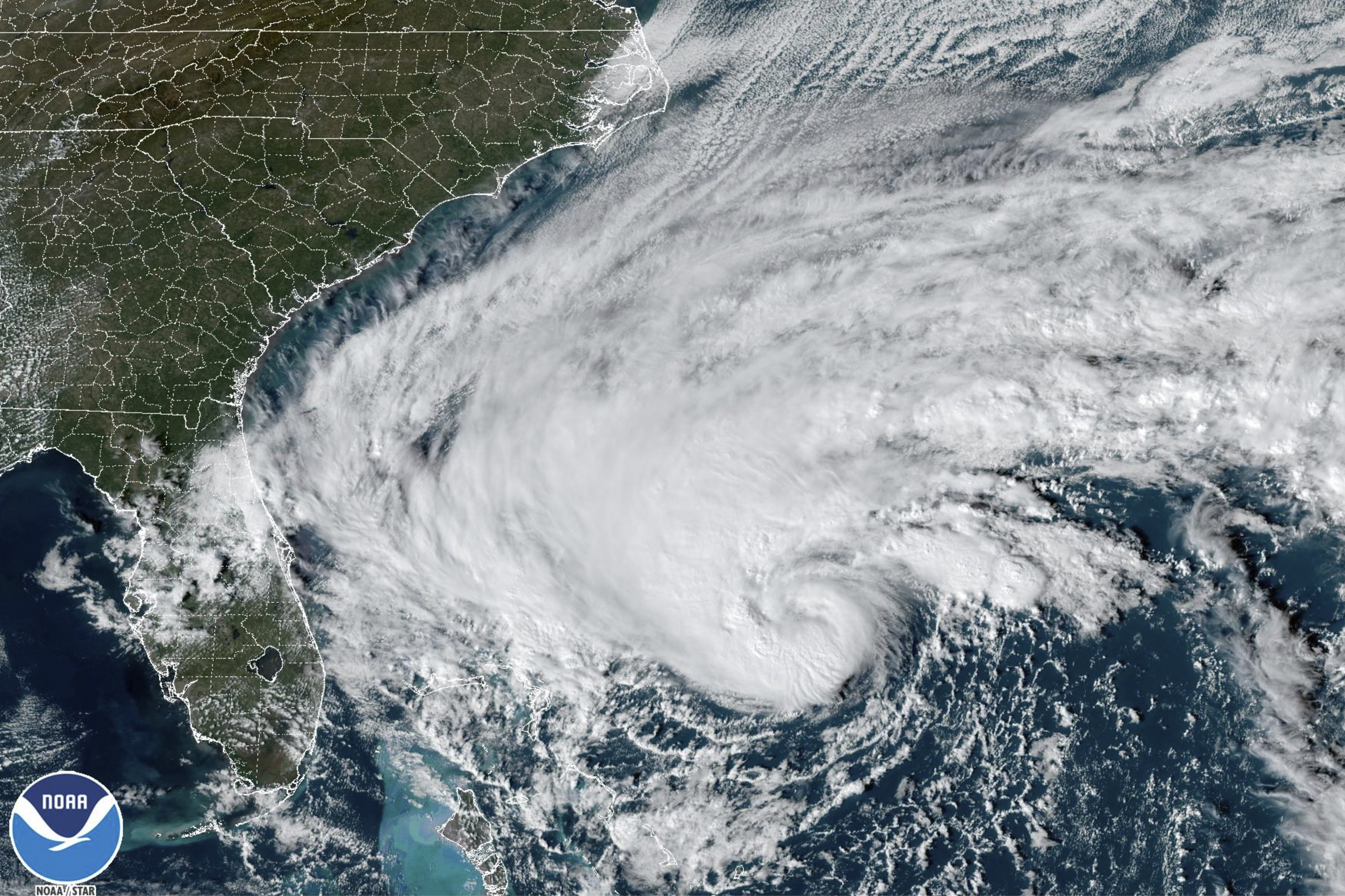 This GOES-East GoeColor satellite image taken on Tuesday afternoon shows Tropical Storm Nicole approaching the northwestern Bahamas and Florida’s Atlantic coastline [NOAA via AP Photo]