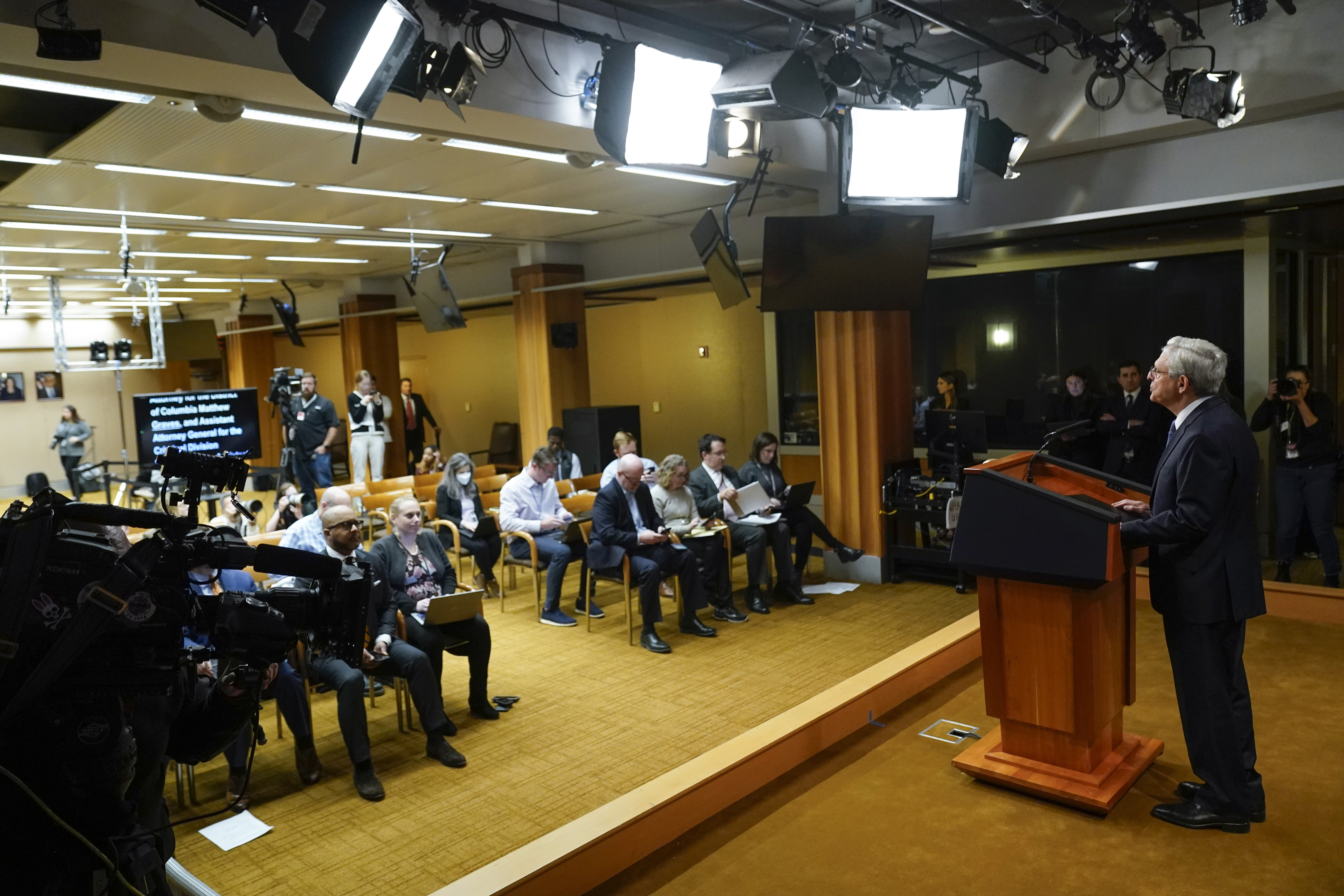 US Attorney General Merrick Garland reads from a teleprompter as he addresses the press on November 18