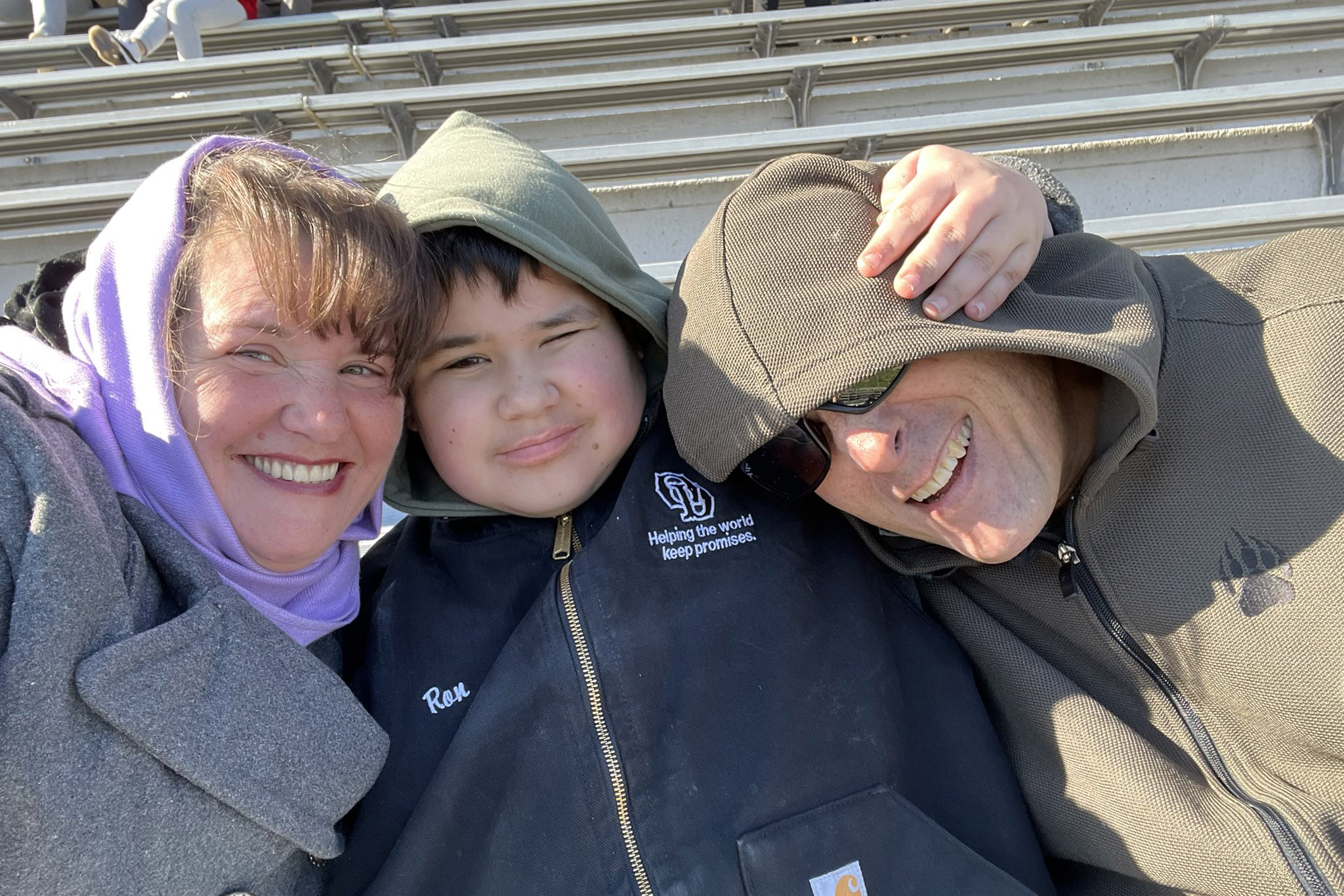 Rebecca Raymond with her husband and son