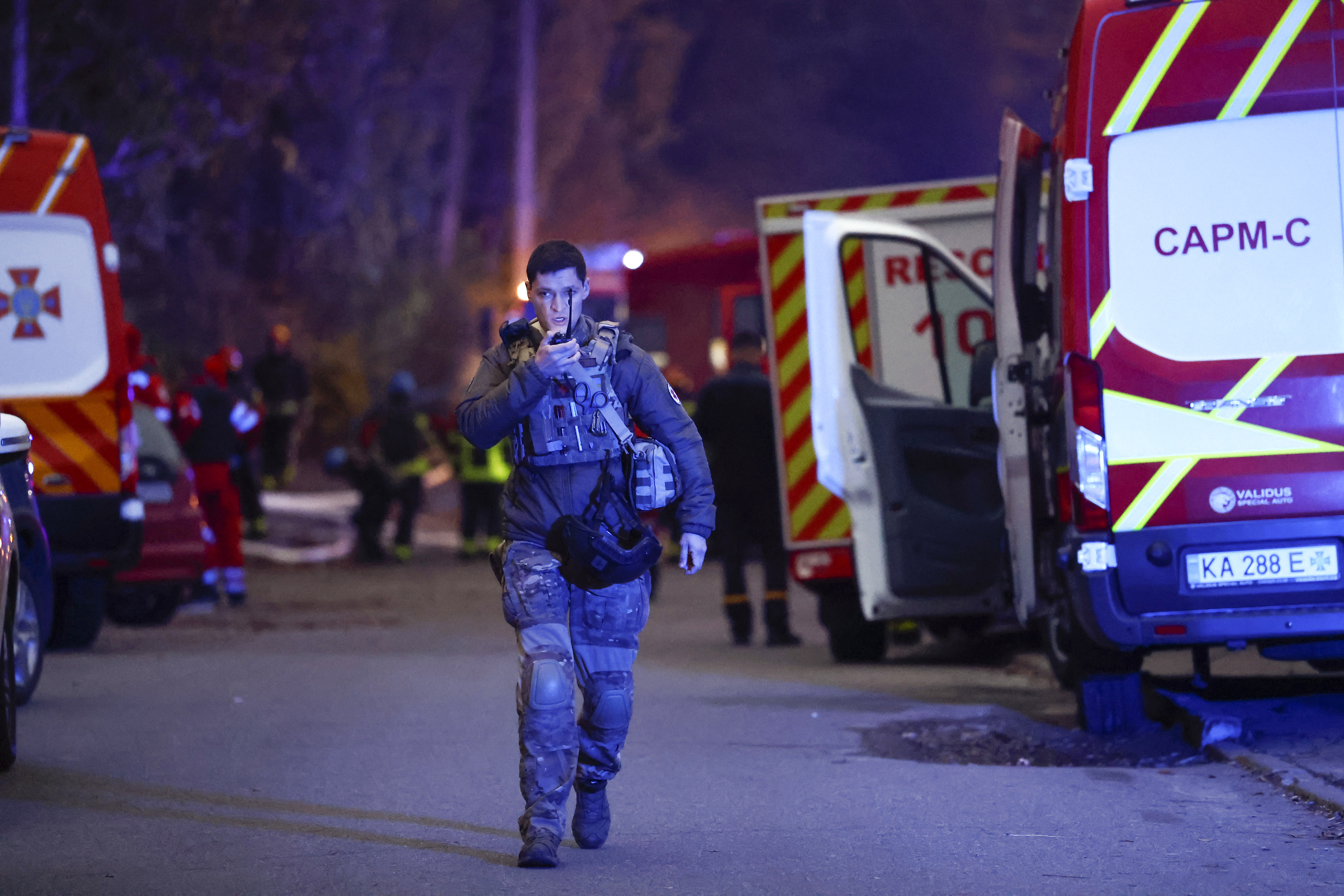 Rescue workers at the scene of a missile strike