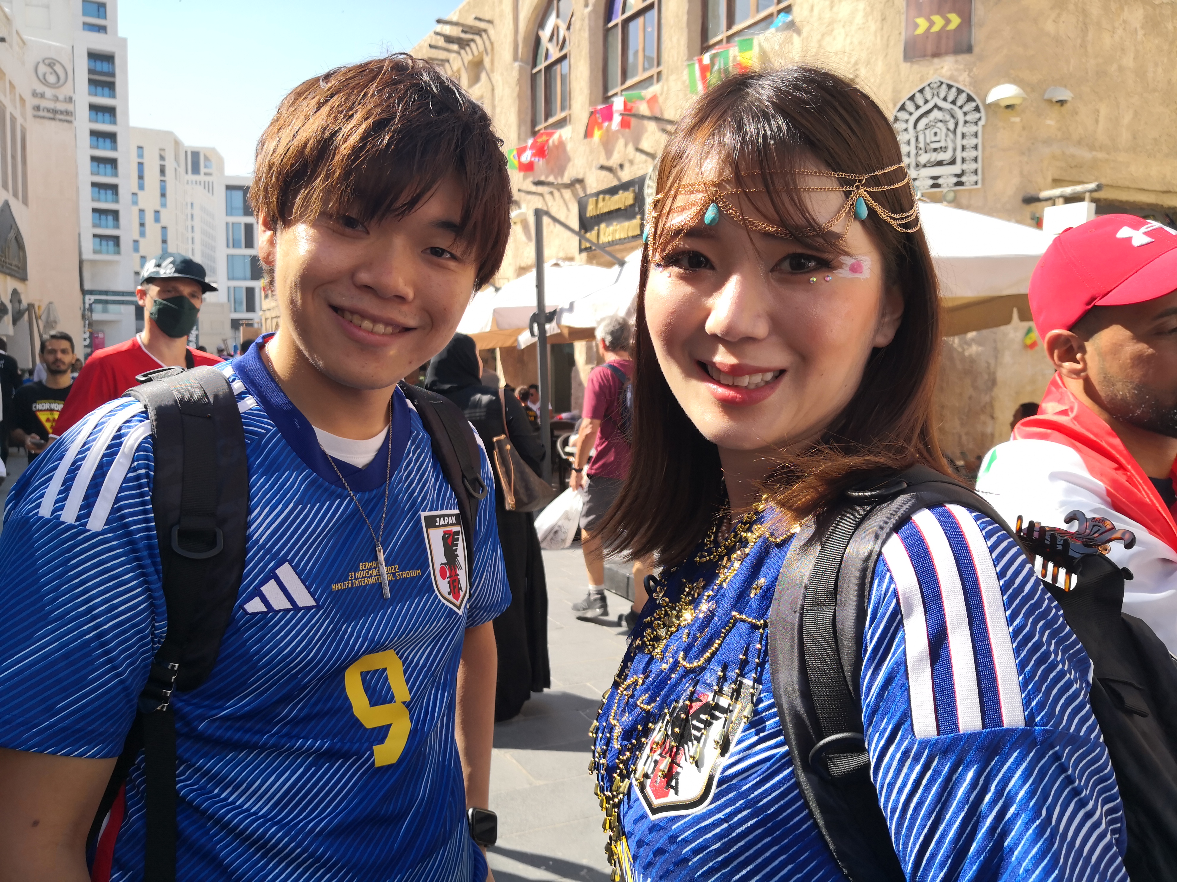 Saysuka in blue Japanese uniform and friend smile at the camera