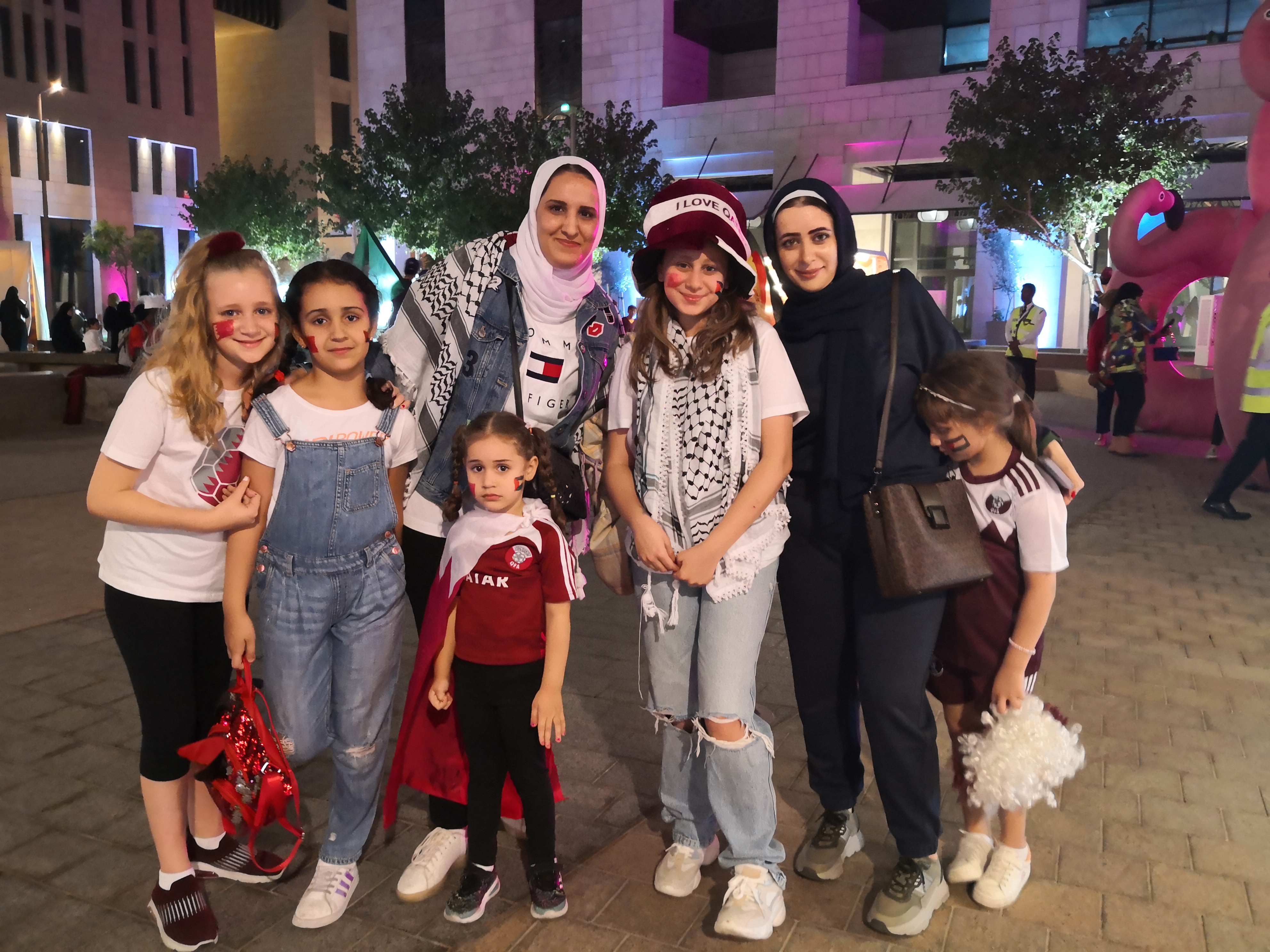 Sonia Nemmas, a Jordanian mother, with her three daughters and friends out in Doha supporting Qatar on Friday, November 18, 2022. (Hafsa Adil/Al Jazeera)