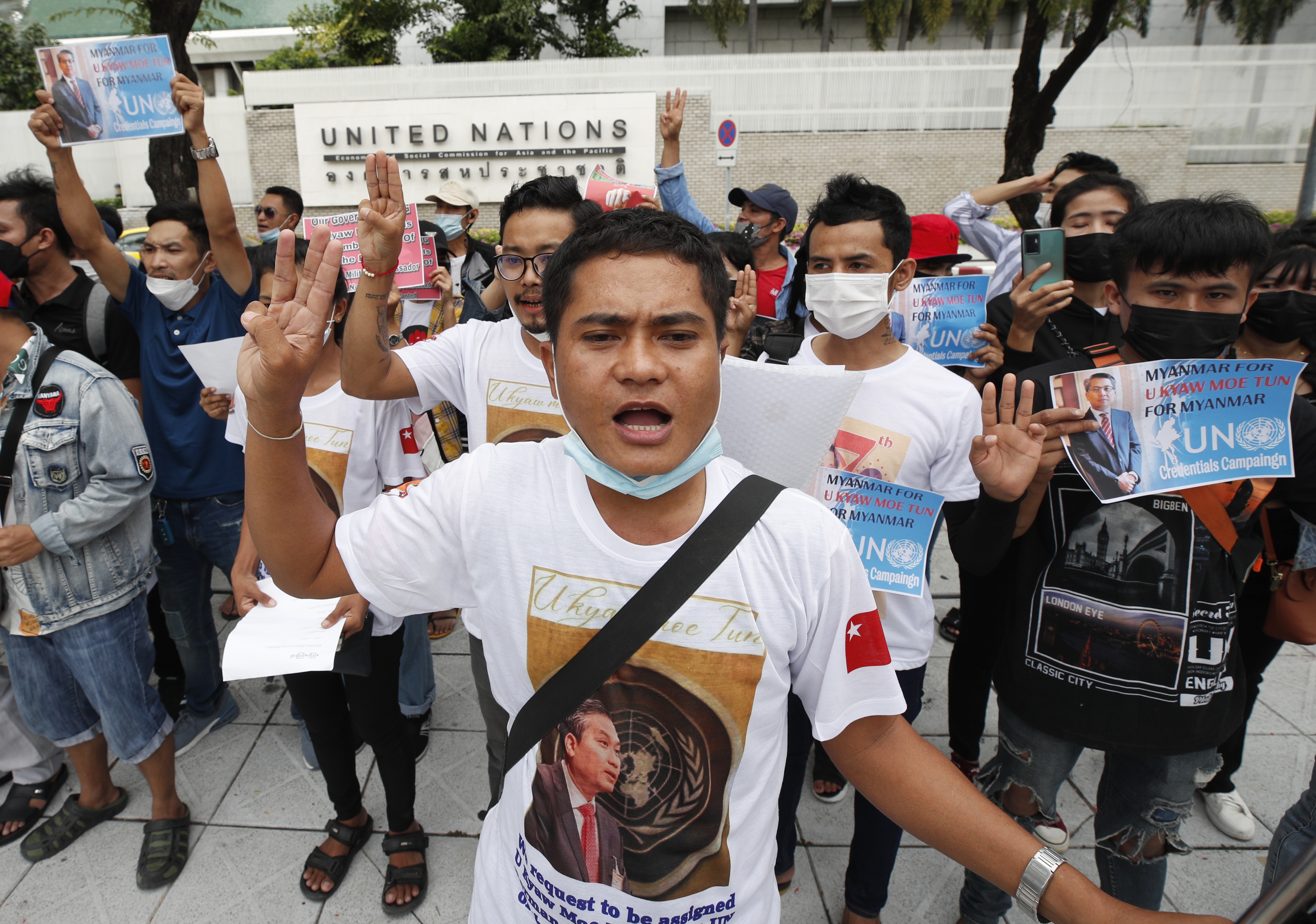 Protesters gather outside the UN in Bangkok in support of Kyaw Moe Tun. They are giving the three finger salute and look determined