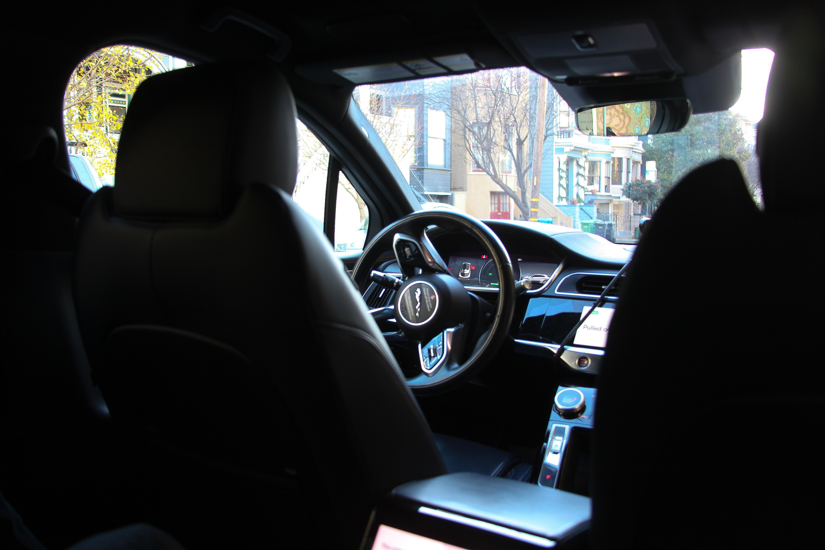 The empty front seat of a driverless Waymo taxi