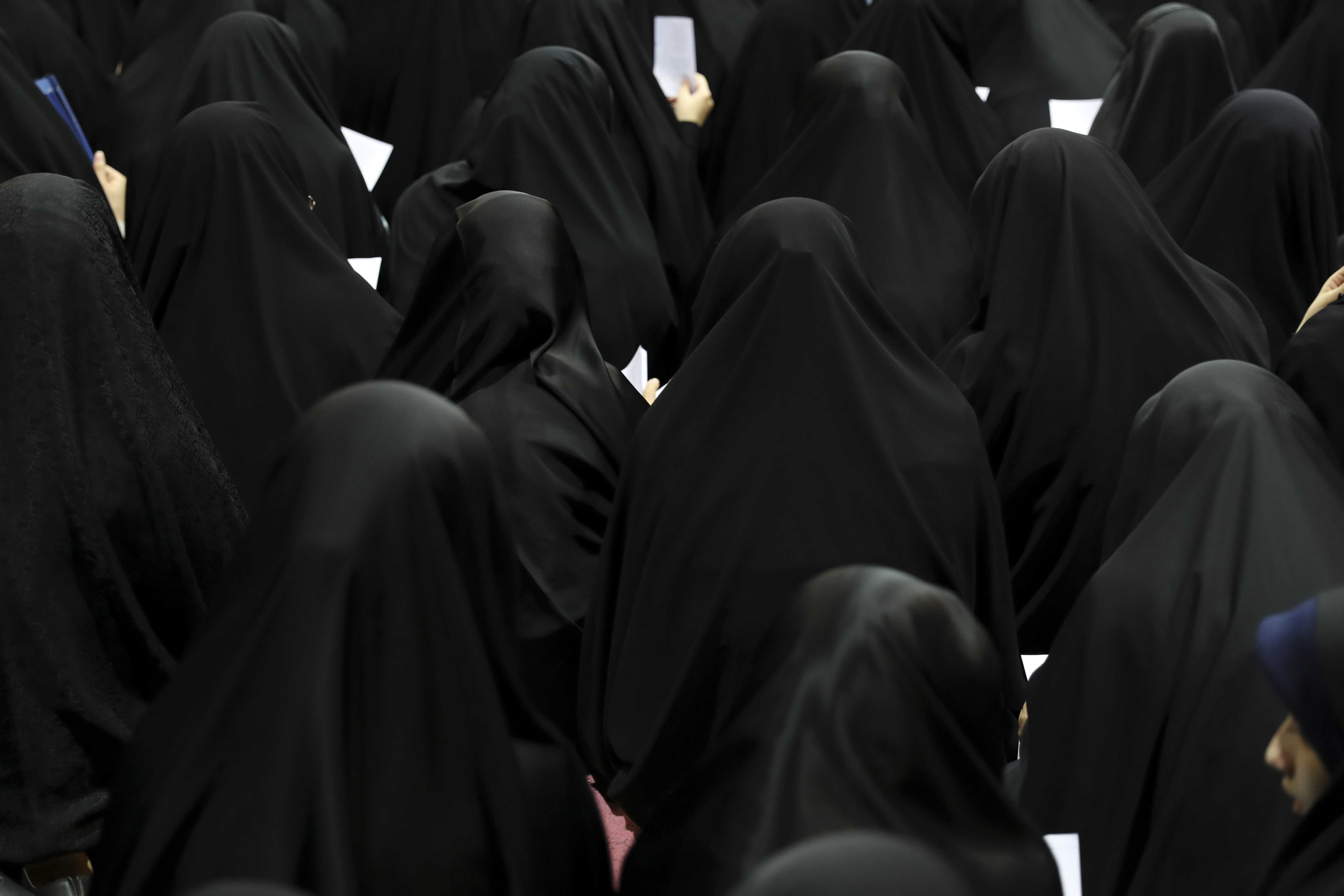 Veiled Iranian woman attend a ceremony