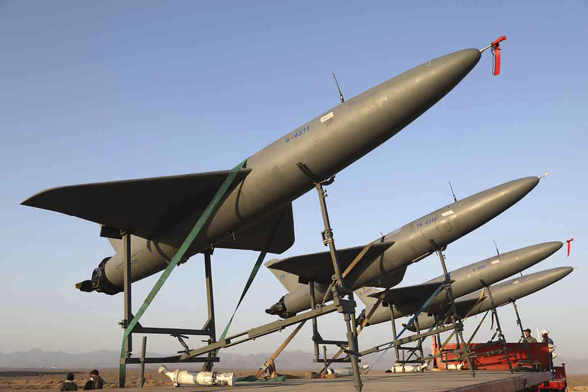 In this photo released by Iranian Army on Aug. 24, 2022, drones are prepared for launch