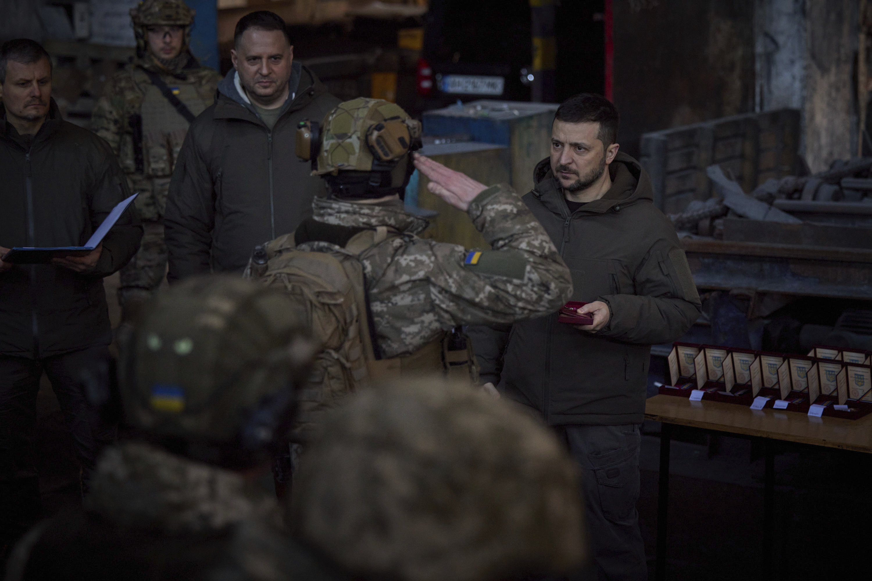 President Zelenskyy awarding soldiers with medals.