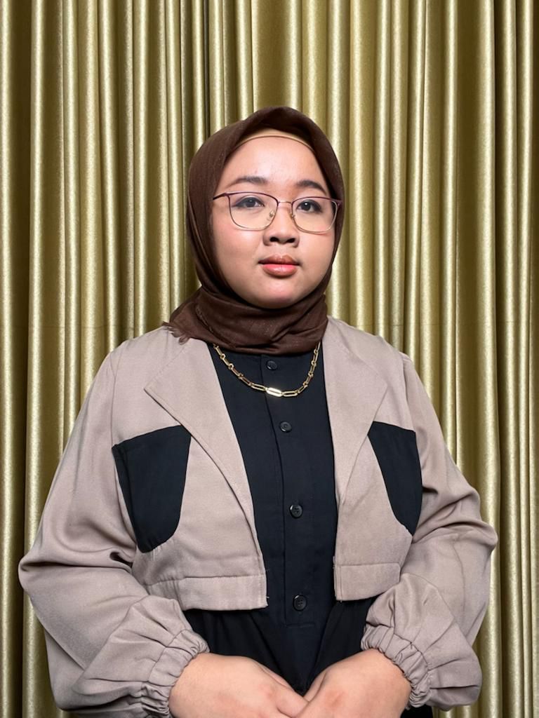 Regi posing for a photo 