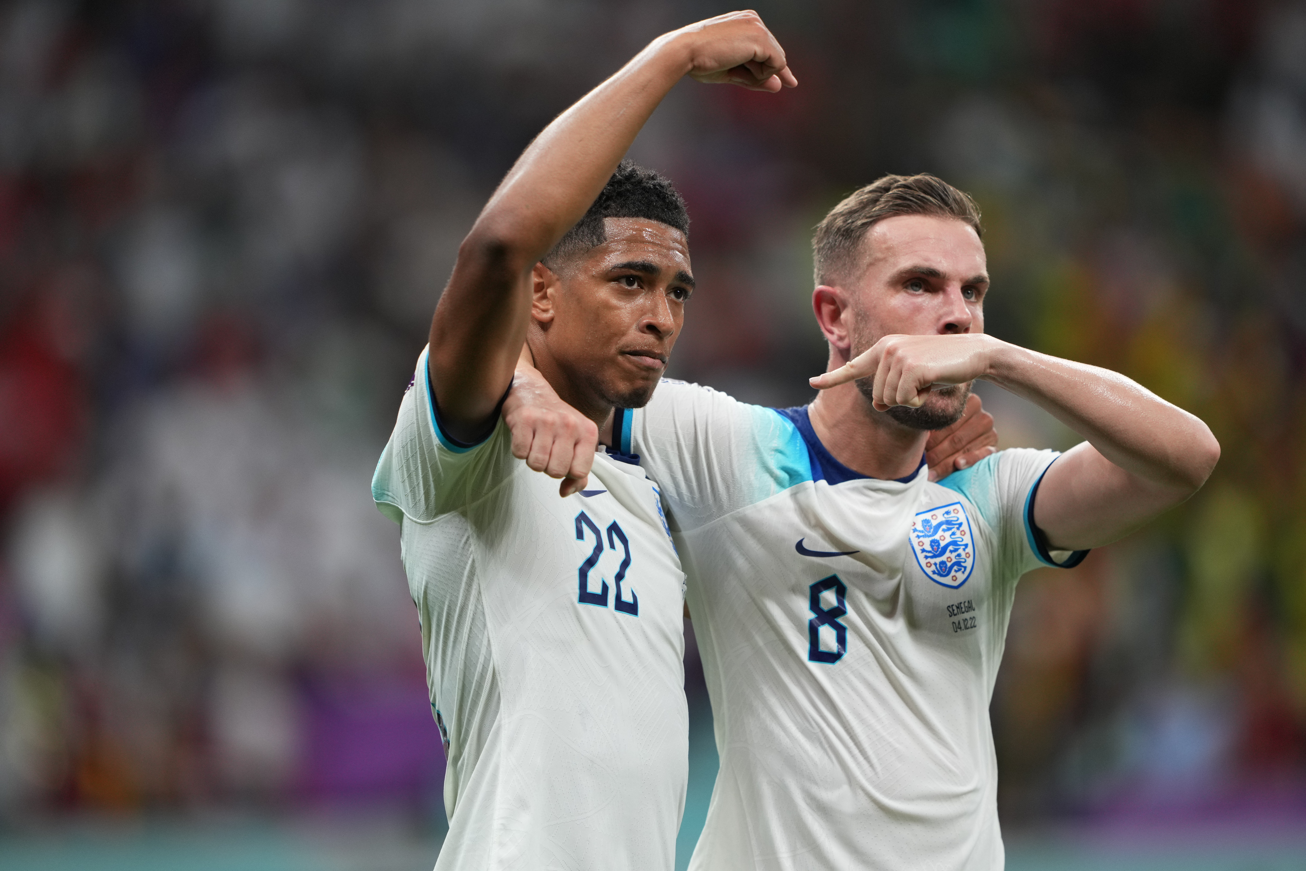 Jordan Henderson and Jude Bellingham celebrate Henderson's first goal.