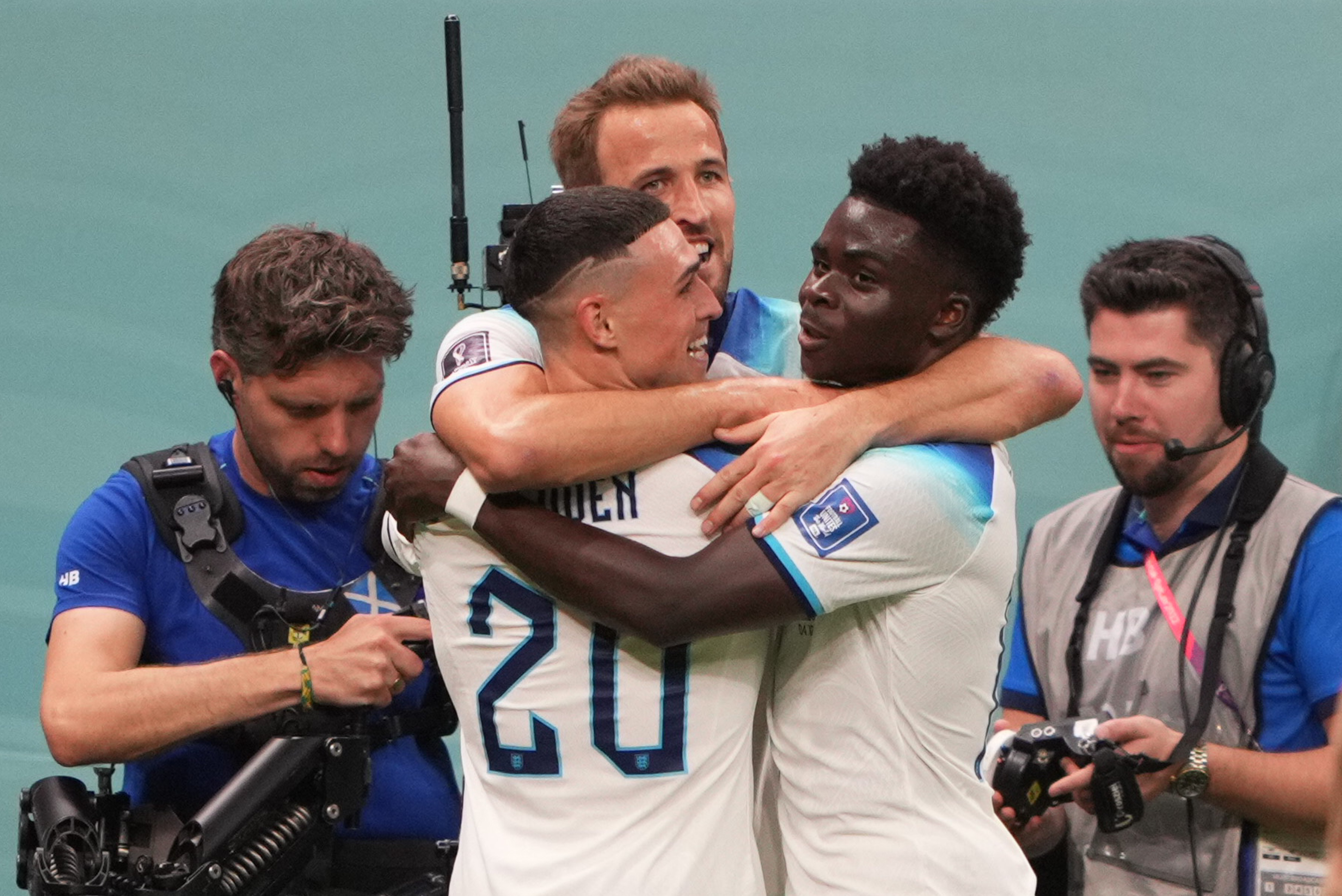 English players celebrate Harry Kane scoring England's second goal.