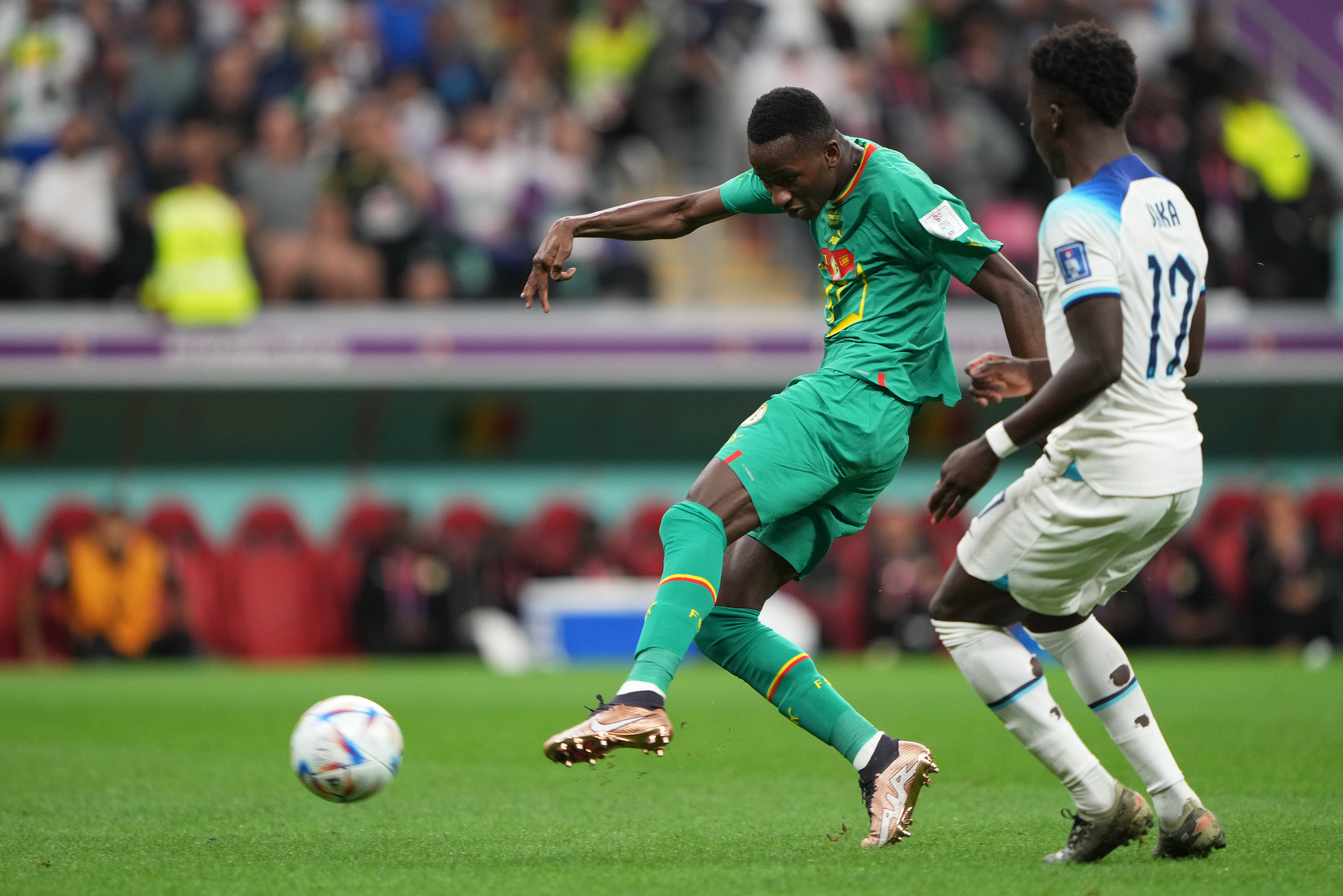 Two players compete for the ball during the England vs Senegal match on December 4, 2022, at Al Bayt Stadium in Qatar 
