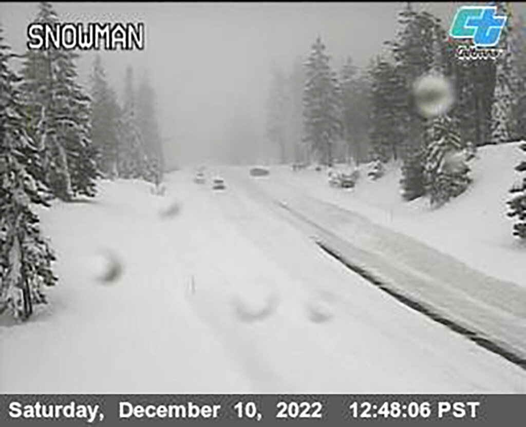 Snow covers a road in the mountains of California