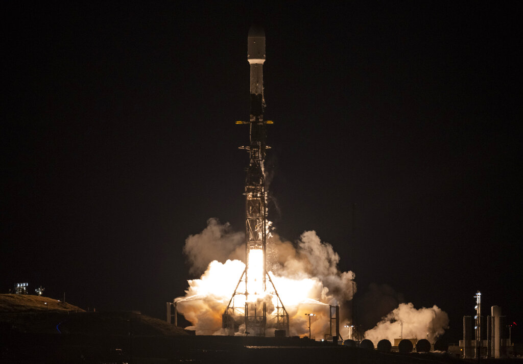 A SpaceX rocket carrying the Surface Water and Ocean Topography satellite lifts off from Vandenberg Space Force Base in California
