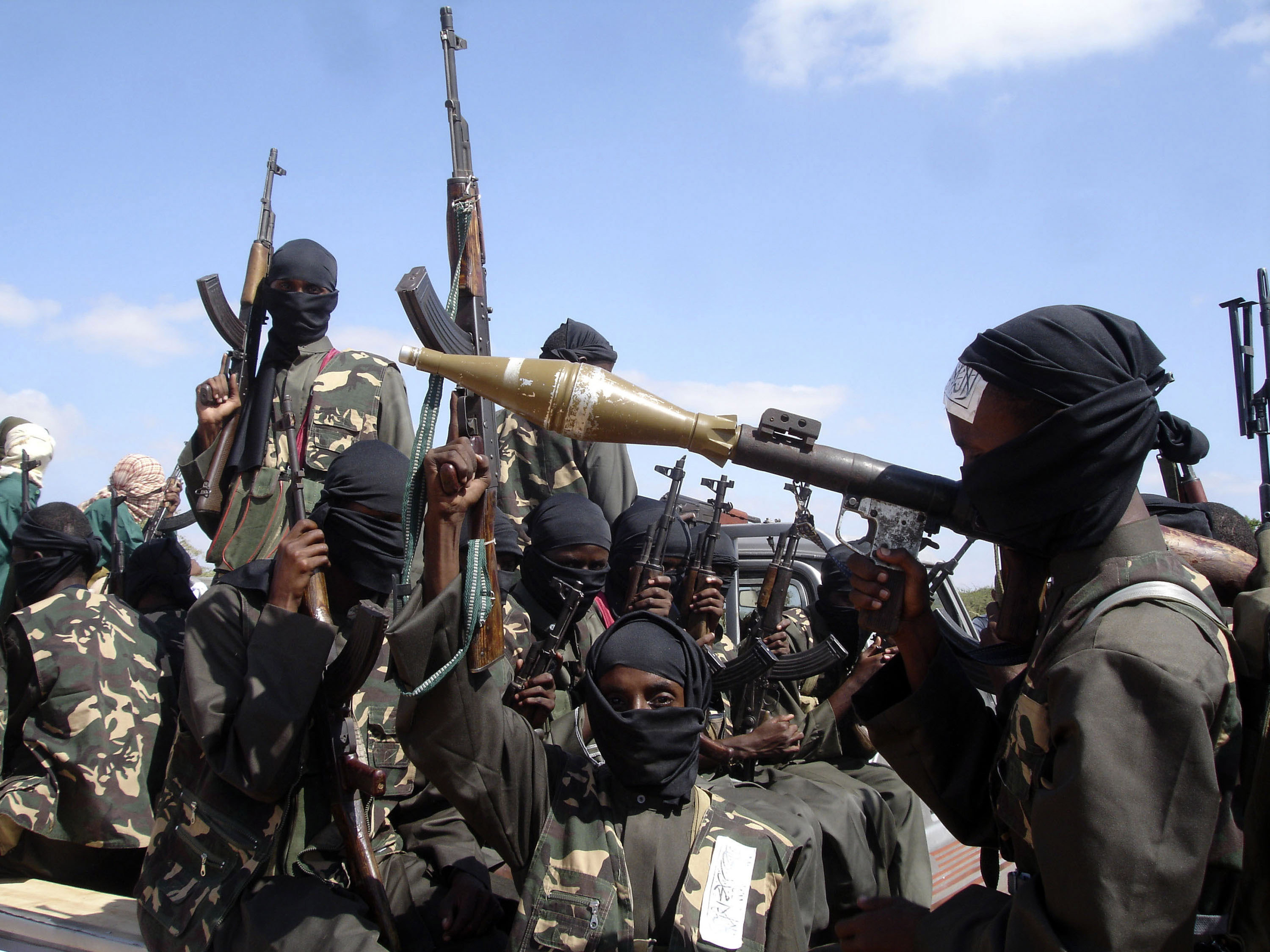 Armed al-Shabab fighters ride on pickup trucks outside the capital Mogadishu