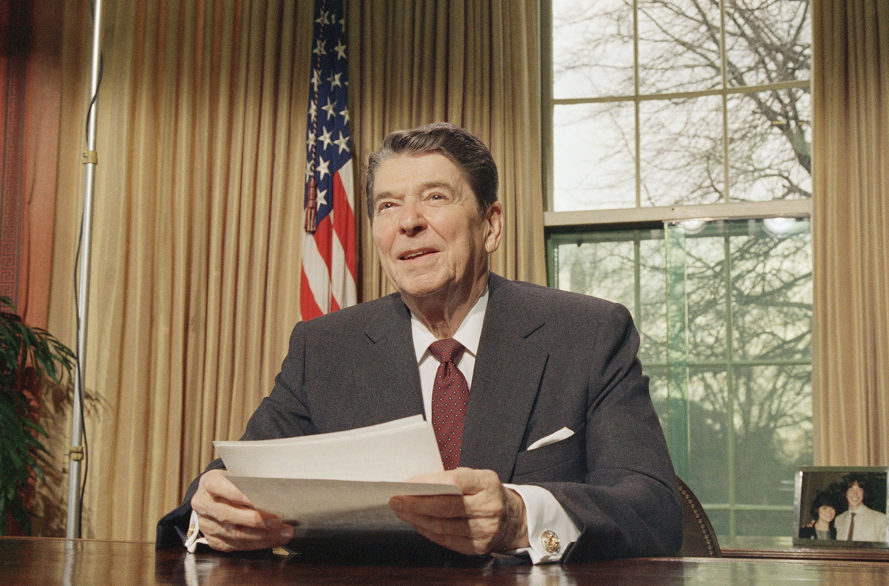 President Ronald Reagan, saying America is still not free of the racism battled by Martin Luther King Jr., asked the nation?s youth on Thursday, Jan. 15, 1987 to strive for a land ?free of bigotry, intolerance and discrimination.? The President, in a television speech beamed by cable and satellite to high school students across the country, said King was an inspiration to all Americans, no matter what their race. (AP Photo/Dennis Cook)