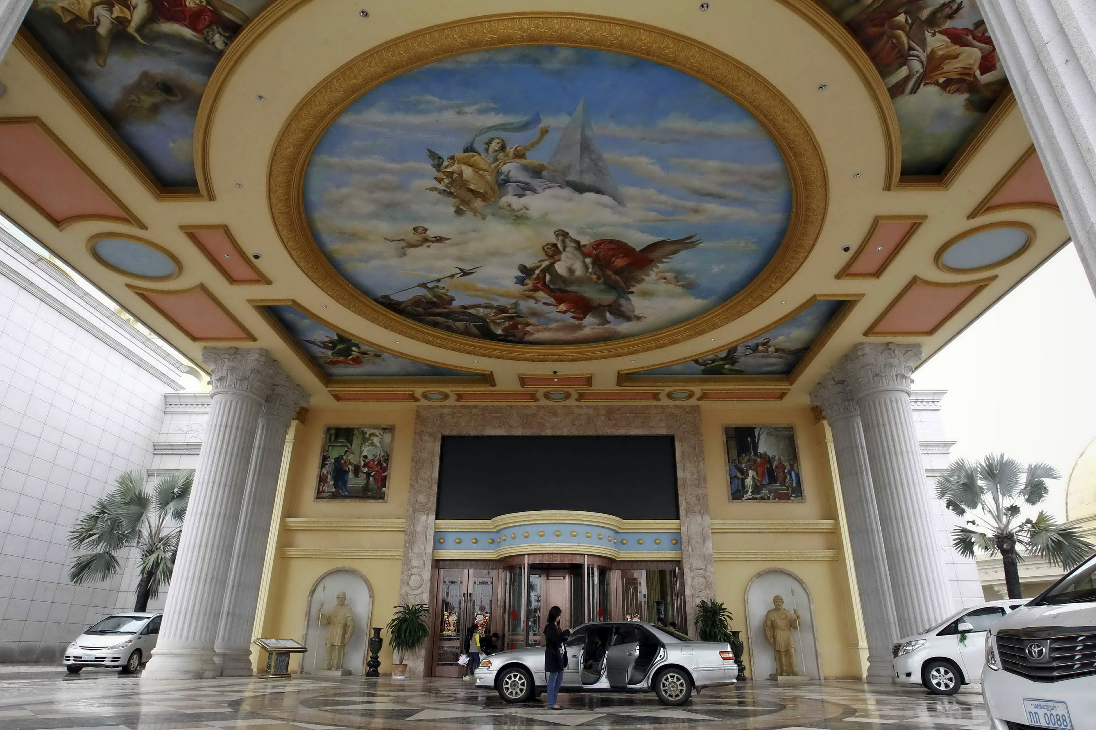 Vehicles stop at the entrance to the Kings Romans casino, part of the Golden Triangle Special Economic Zone run by Chinese company Jin Mu Mian, in Laos along the Mekong river opposite Sop Ruak in the Golden Triangle region bordering Thailand, Laos and Myanmar.
