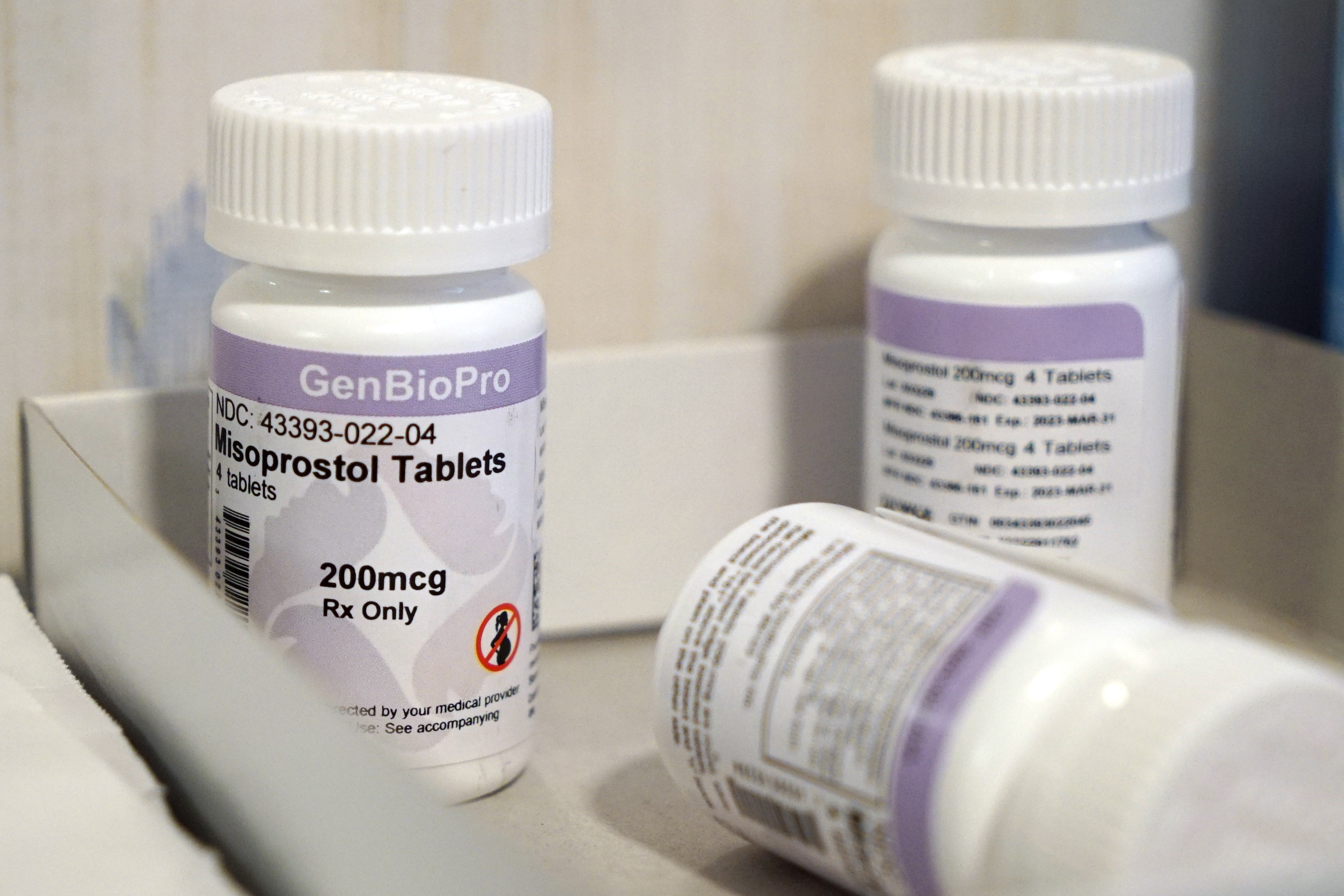 Bottles of the drug misoprostol sit on a table 
