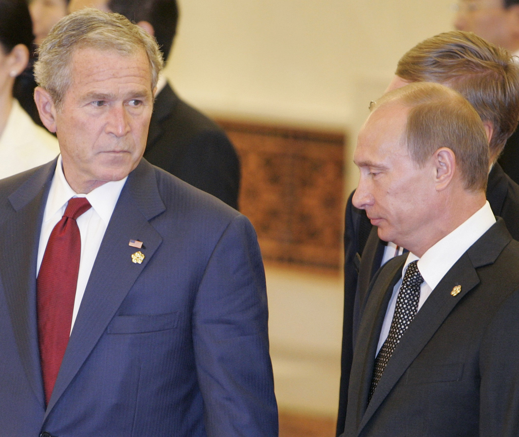 U.S. President George W. Bush (L) and Russian Prime Minister Vladimir Putin are seen in the Great Hall of the People before a reception in honour of the 2008 Summer Olympic Games in Beijing August 8, 2008. REUTERS/Larry Downing (CHINA)