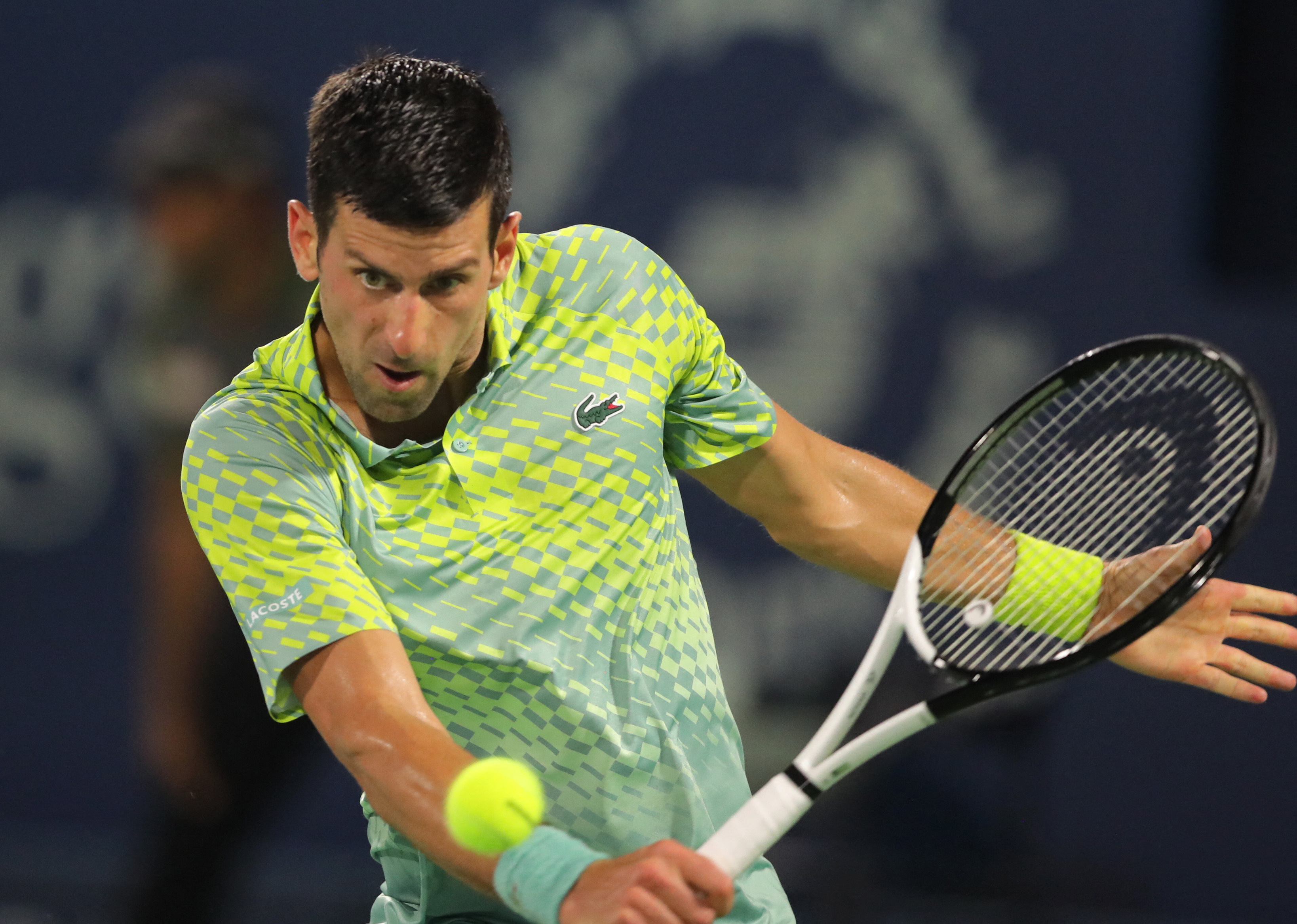Novak Djokovic during a match in Dubai in March. He is playing a back hand.