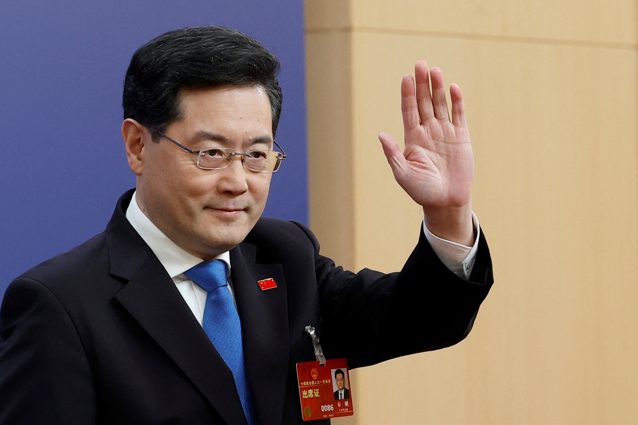 China's foreign minister Qin Gang waves