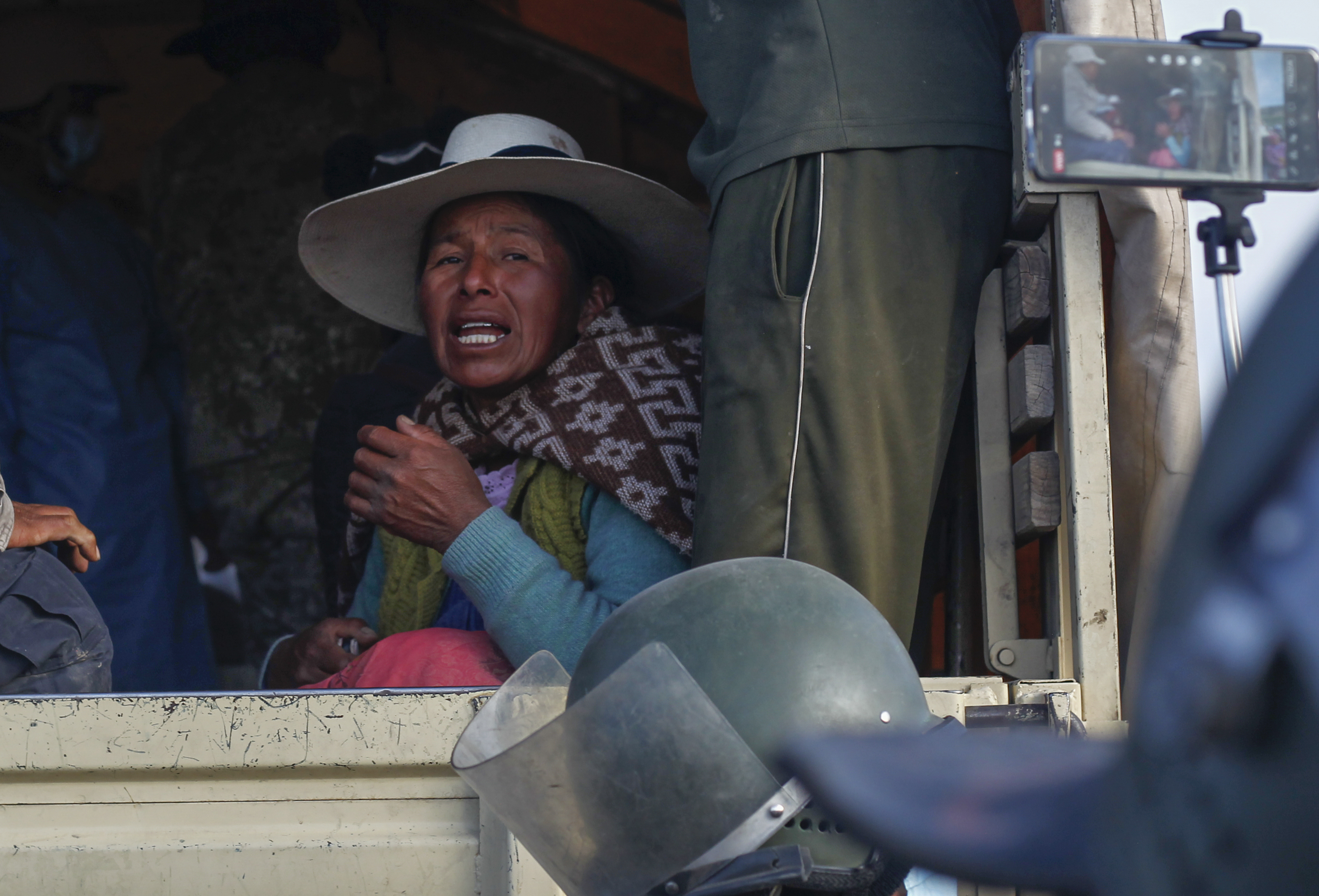 A relative of a soldier who drowned after jumping into the freezing waters of the river Ilave while fleeing clashes with anti-government protesters throwing rocks at them