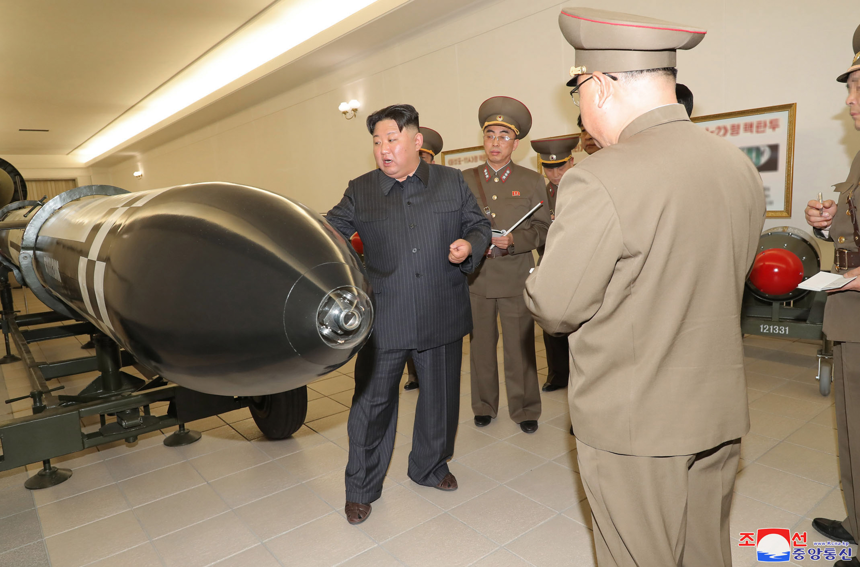 North Korean leader Kim Jong Un inspects a nuclear weaponisation project at an unknown location in North Korea.