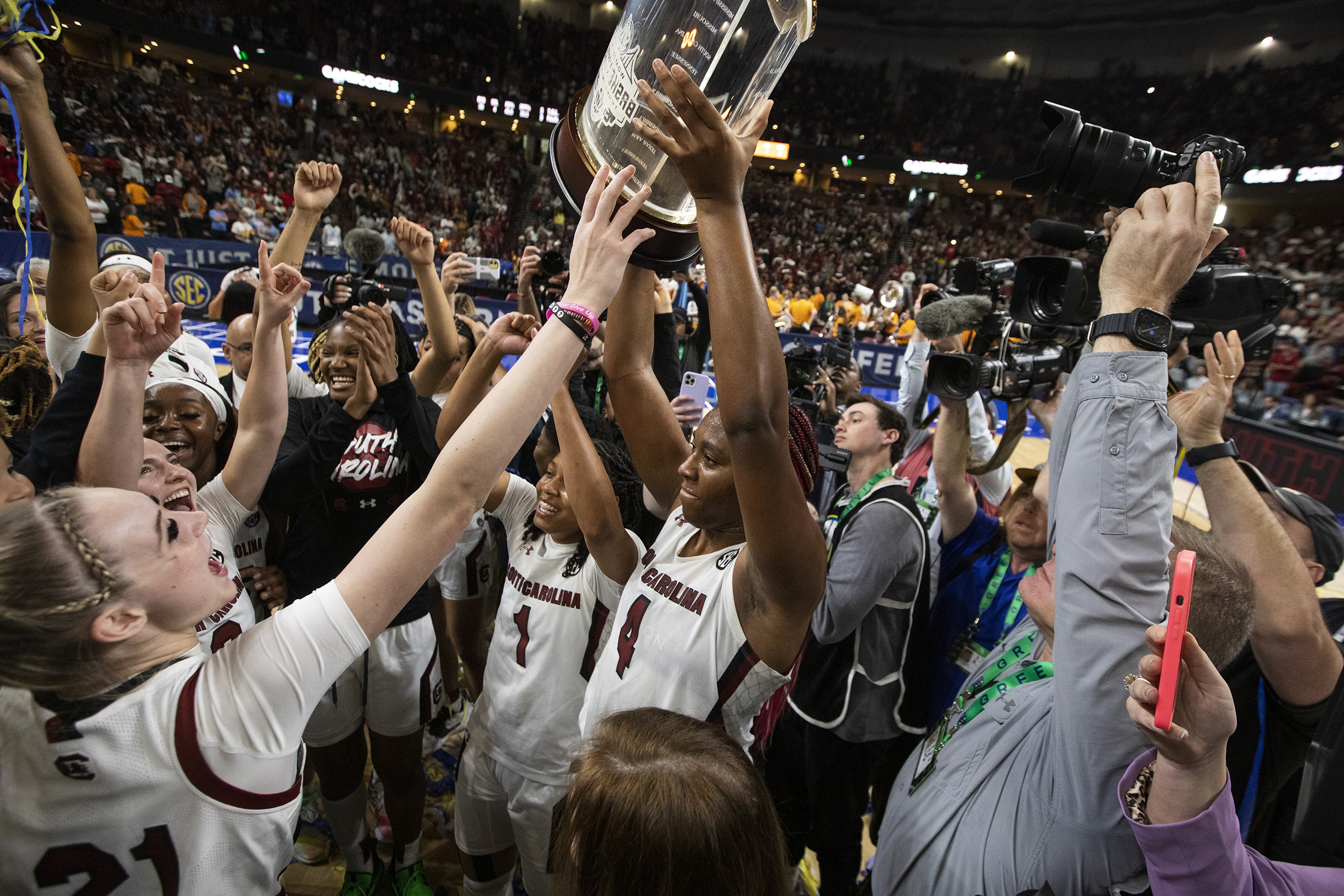 South Carolina's Aliyah Boston holds up the conference championship trophy in 2023.