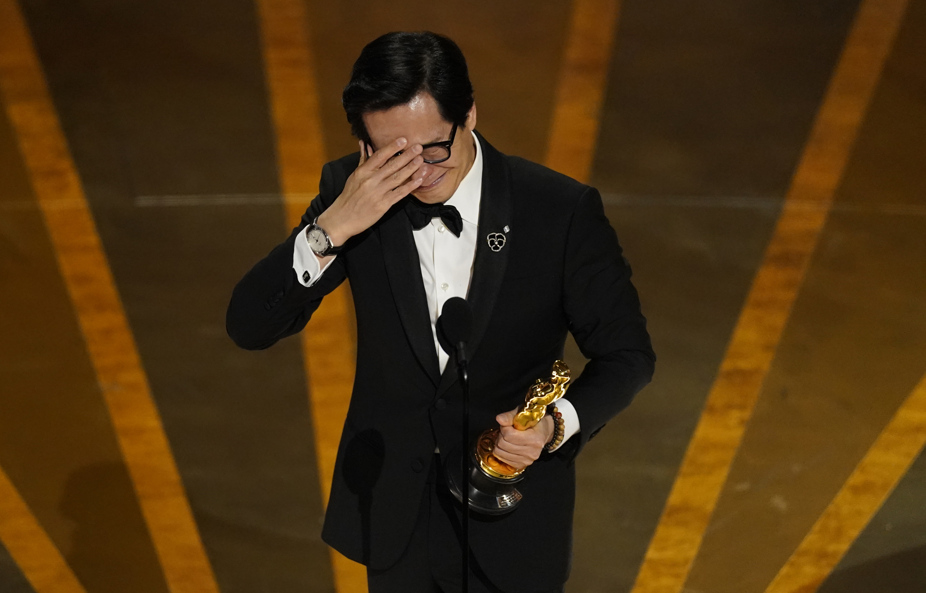 Ke Huy Quan tears up at the Oscars