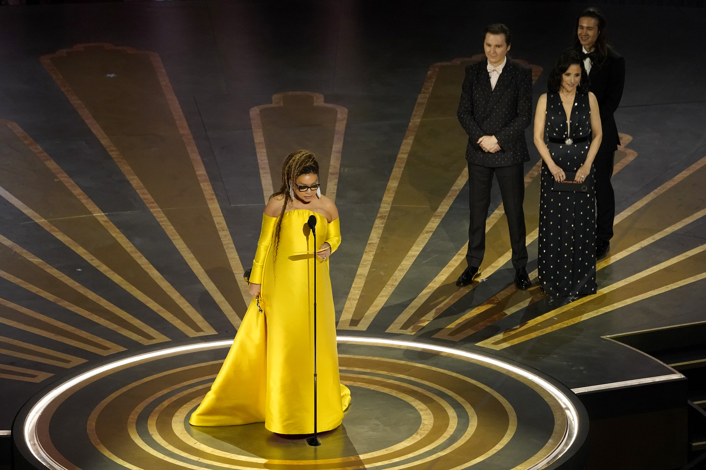 Ruth Carter centerstage, speaking in microphone