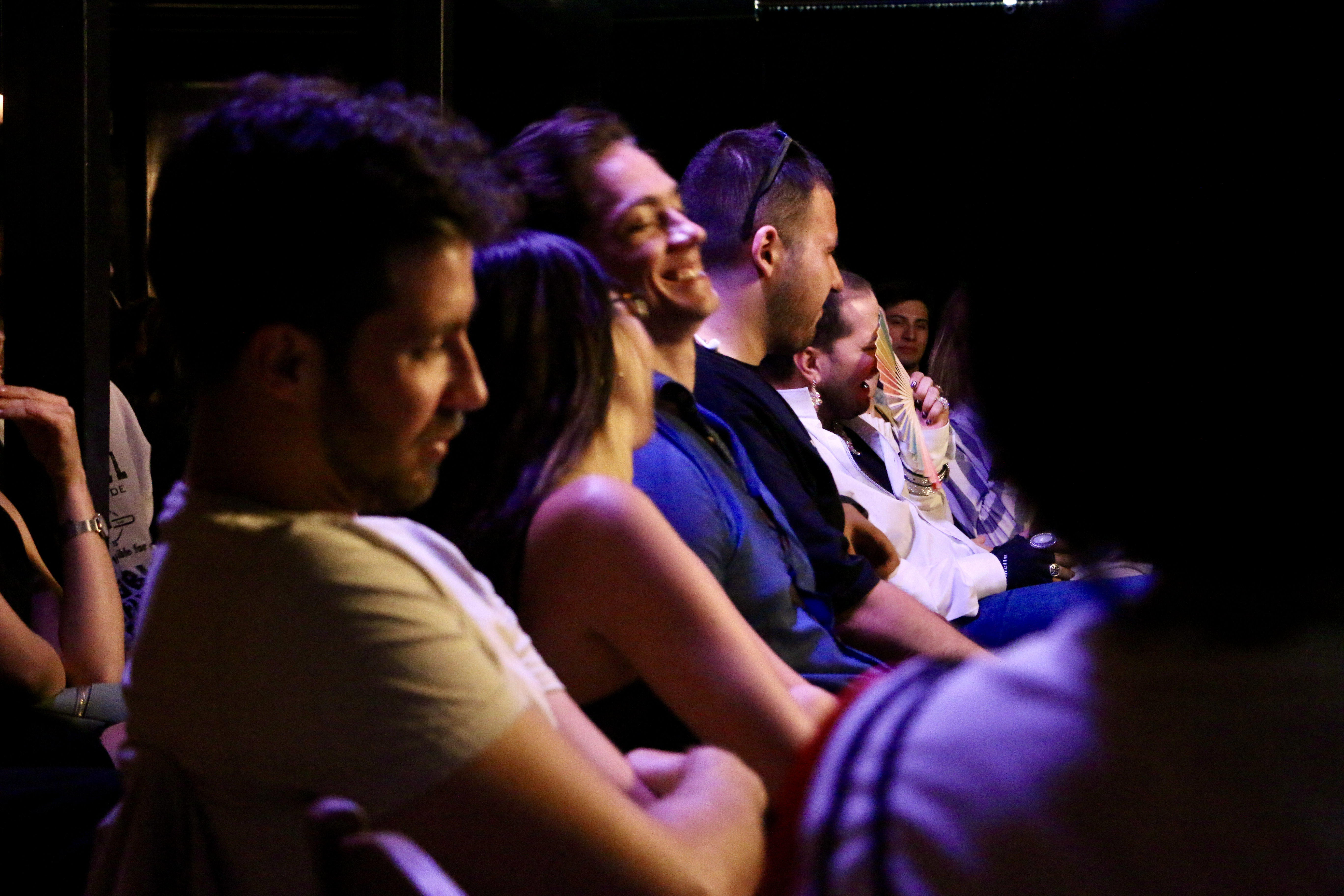 A photo of the audience at a comedy club.