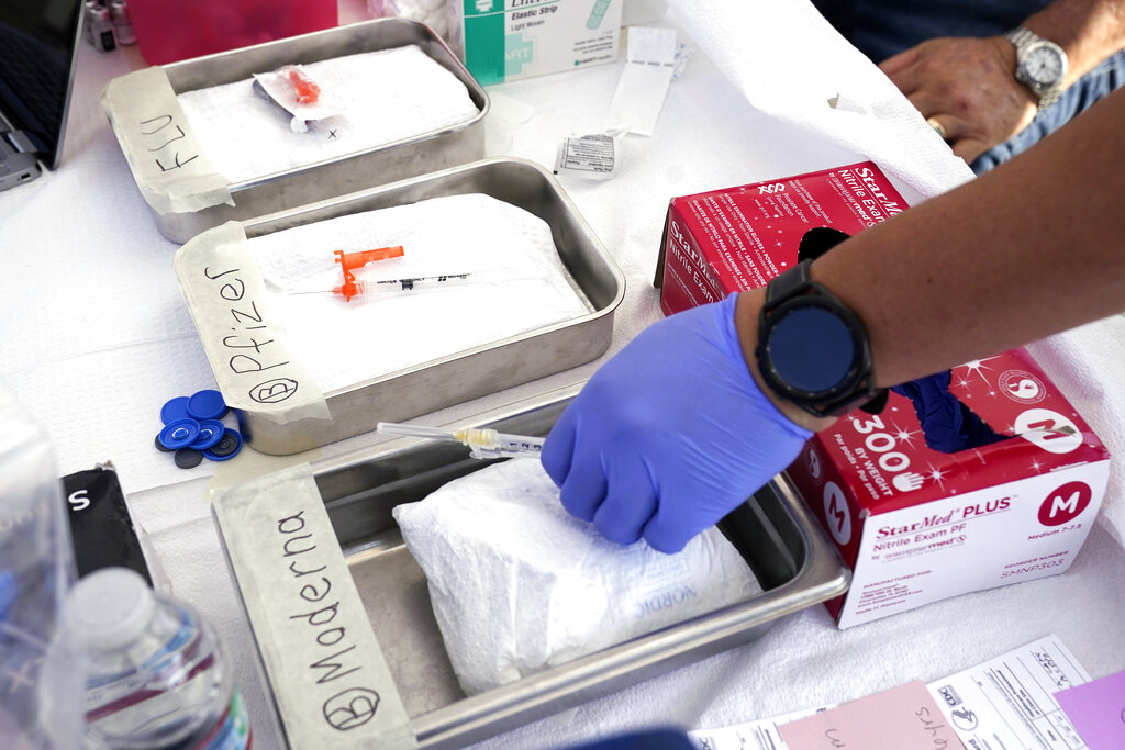 A medical worker preparing vaccines