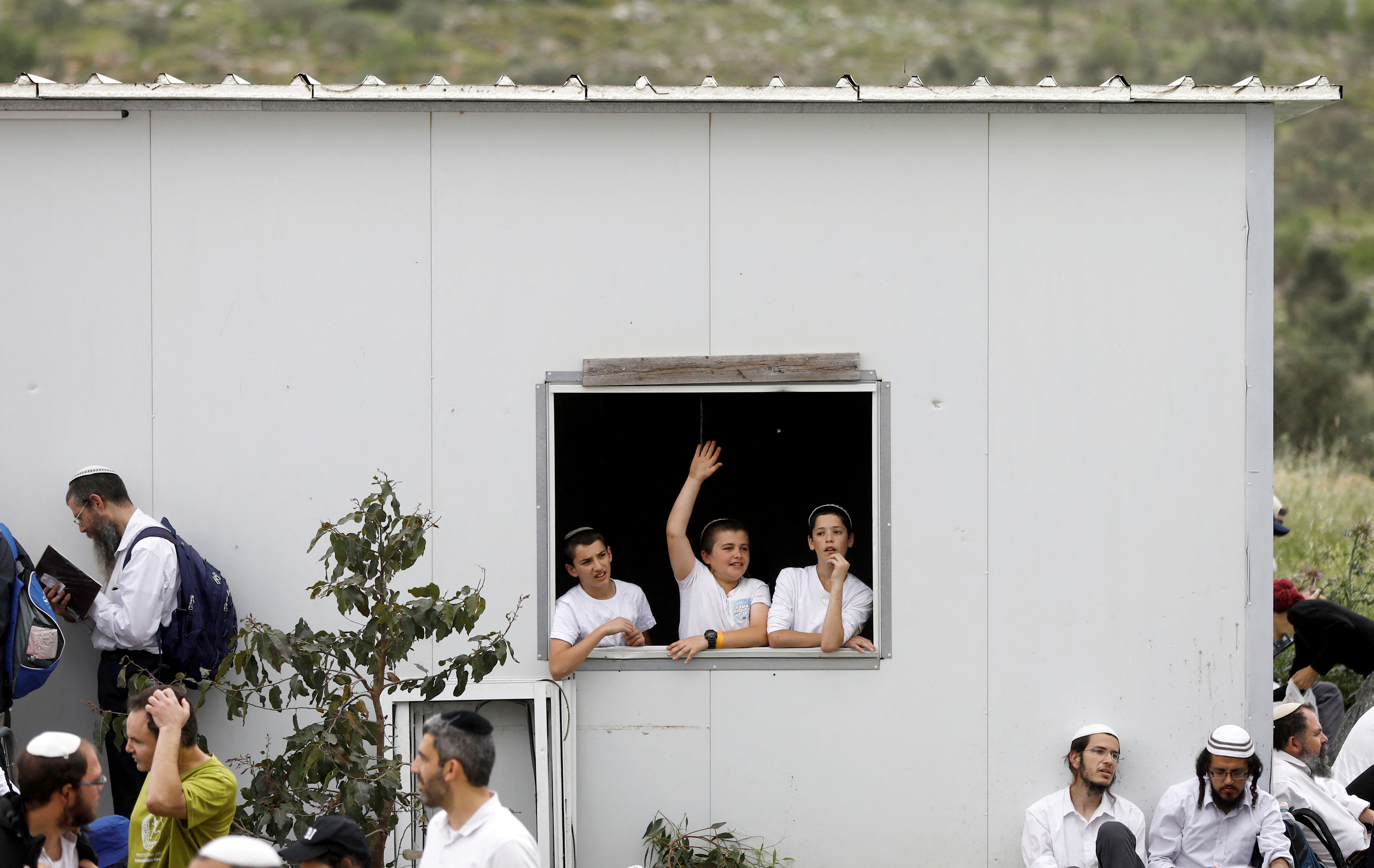 Israeli settlers hold a protest march