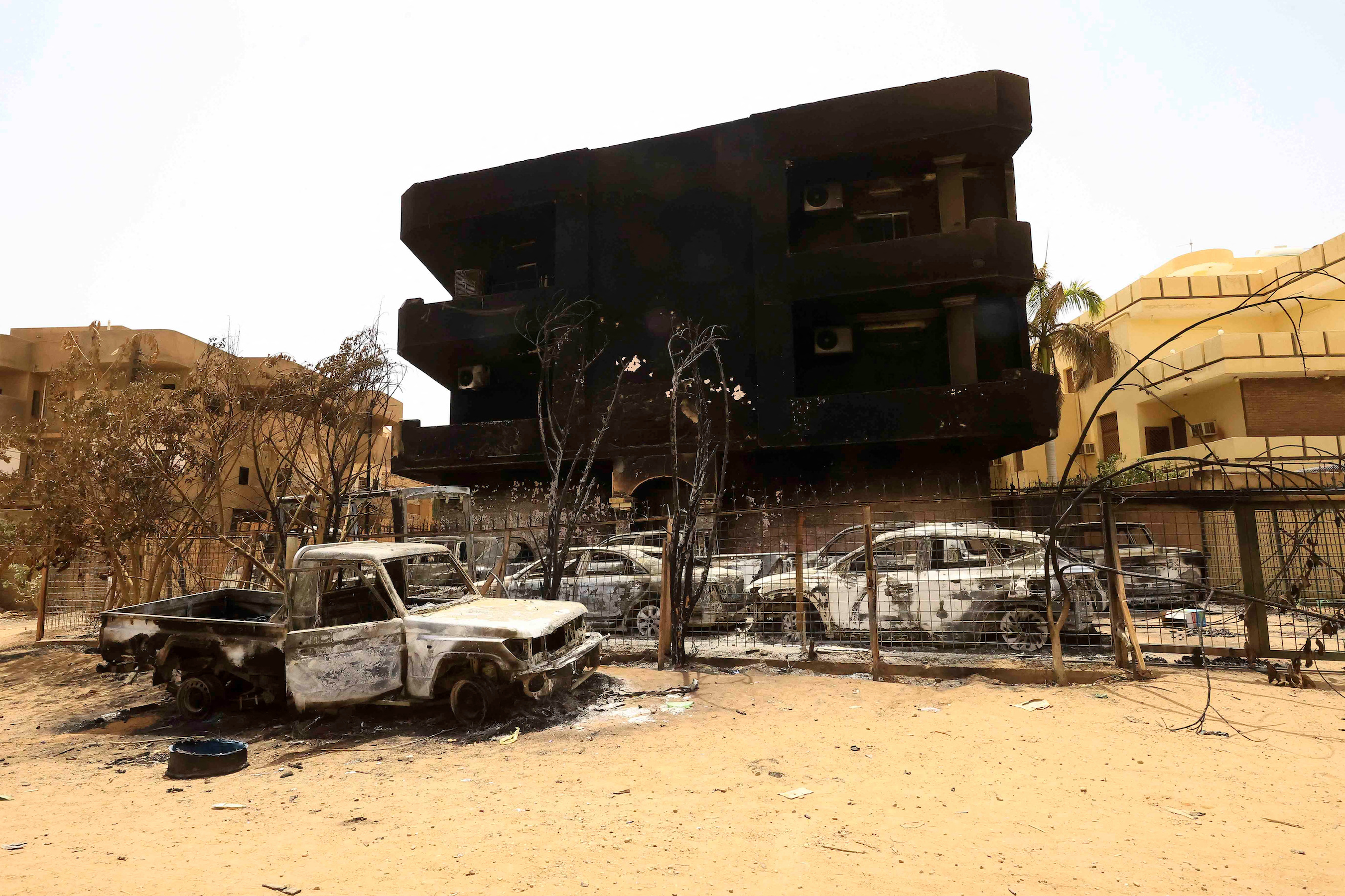 Damaged cars and buildings are seen at the central market during clashes between the paramilitary Rapid Support Forces and the army in Khartoum North, Sudan.