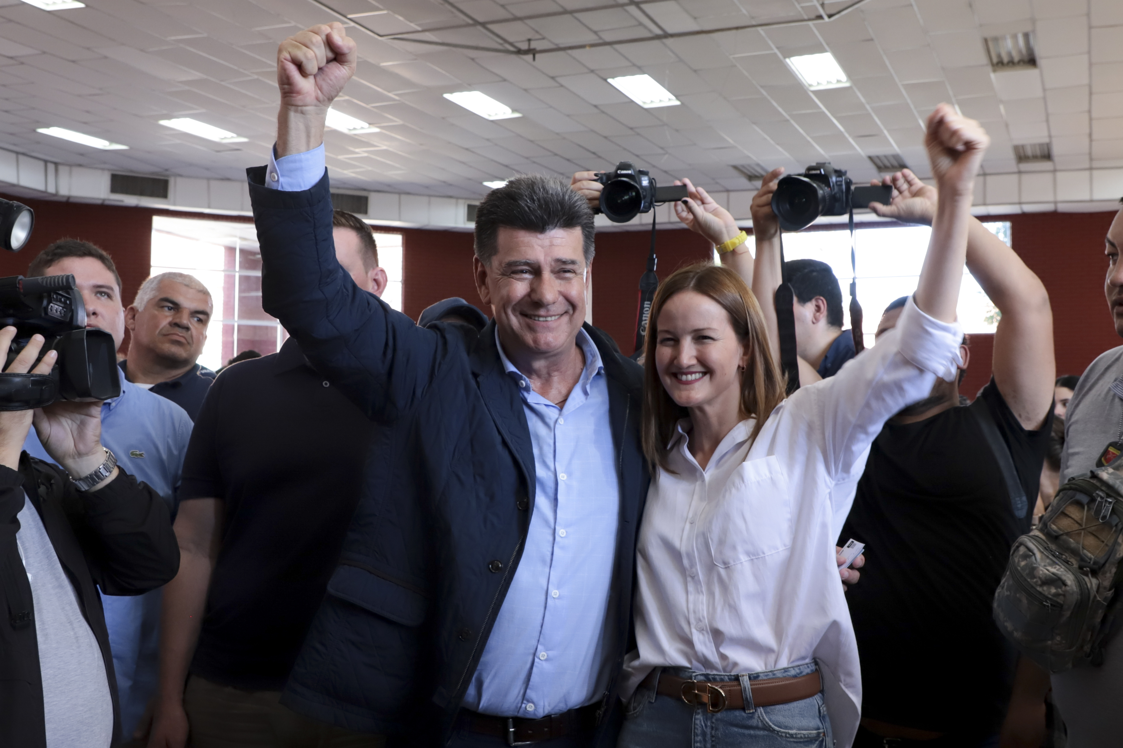 Efrain Alegre, presidential candidate for the Concertacion coalition, and running mate Soledad Nunez pose for a picture at a polling station during general elections in Lambare, outskirts Asuncion, Sunday, April 30, 2023. (AP Photo/Marta Escurra)