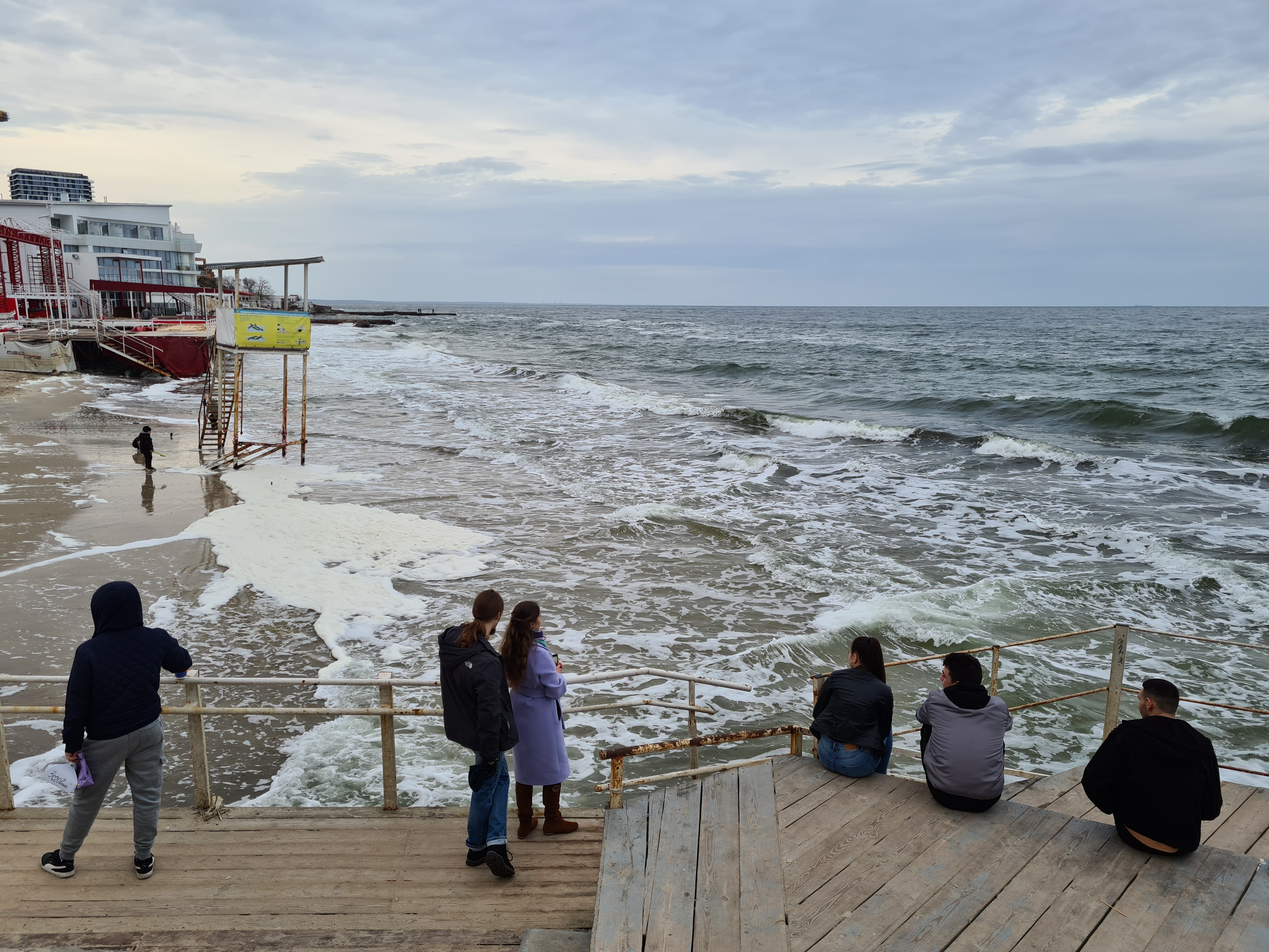 Odesans promenading on the beach