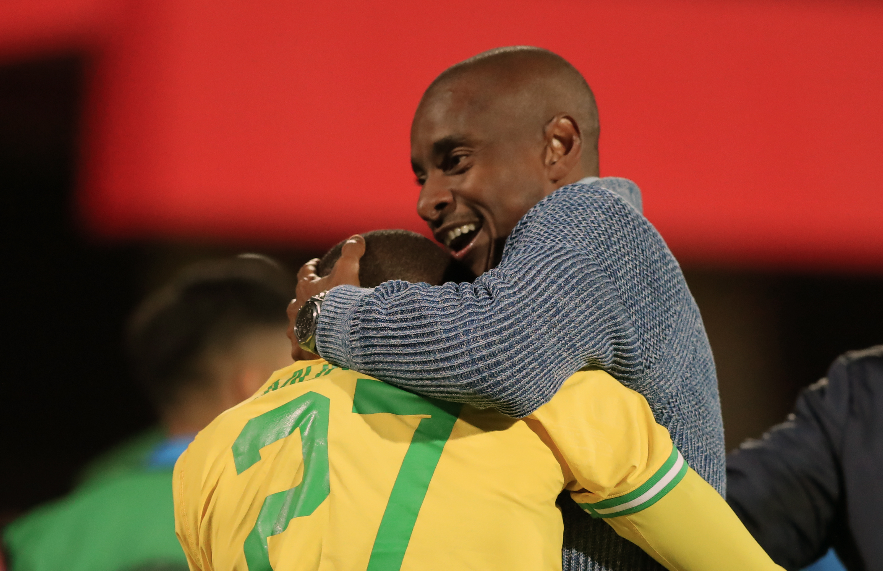 epa10491377 Sundownss head coach Rulani Mokwena celebrate with Thapelo Morena scoring his goal during the CAF Champions League soccer match between Al-Ahly and Mamelodi Sundowns in Cairo, Egypt, 25 February 2023. EPA-EFE/KHALED ELFIQI