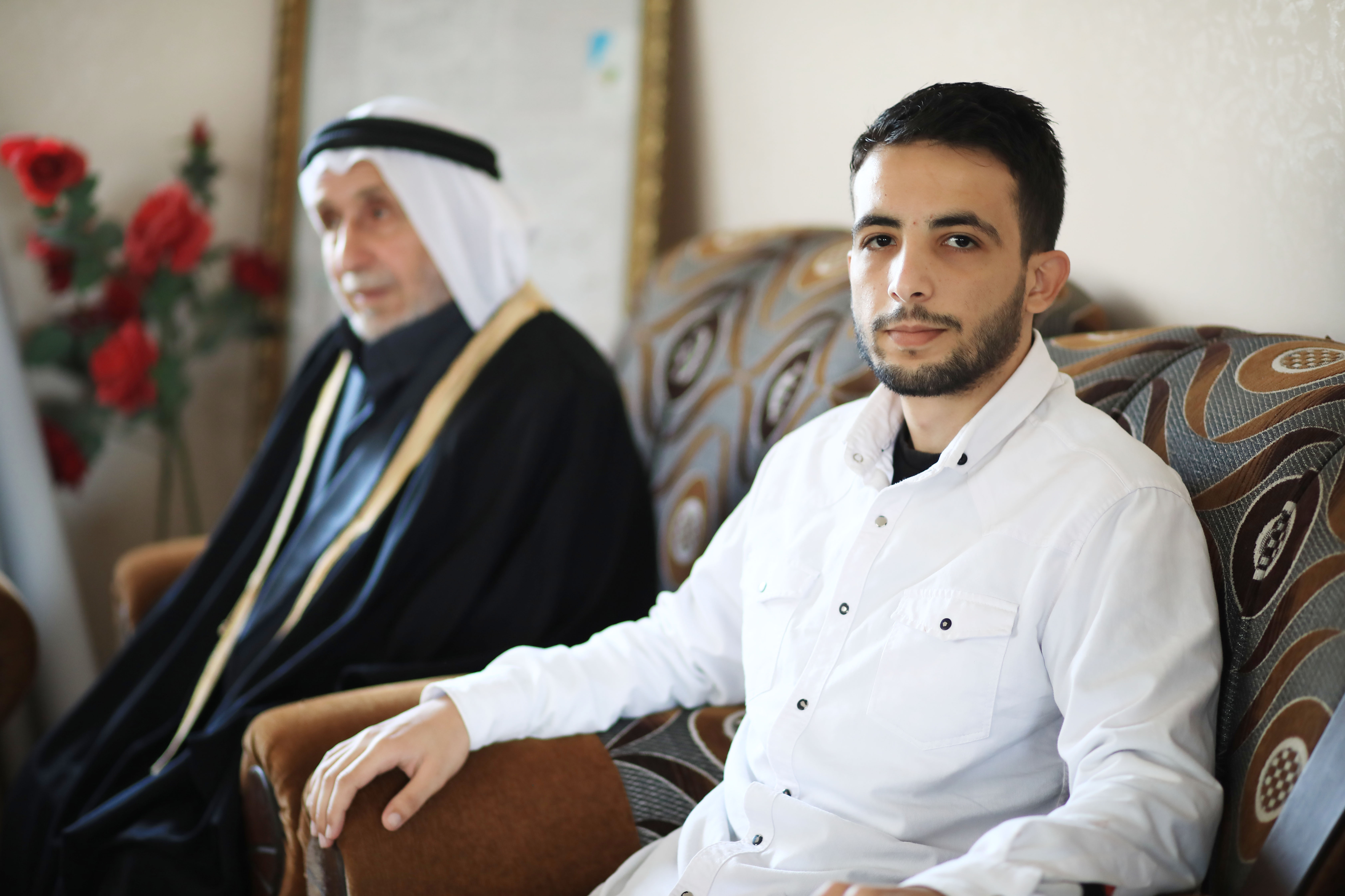 A young man next to his grandfather 