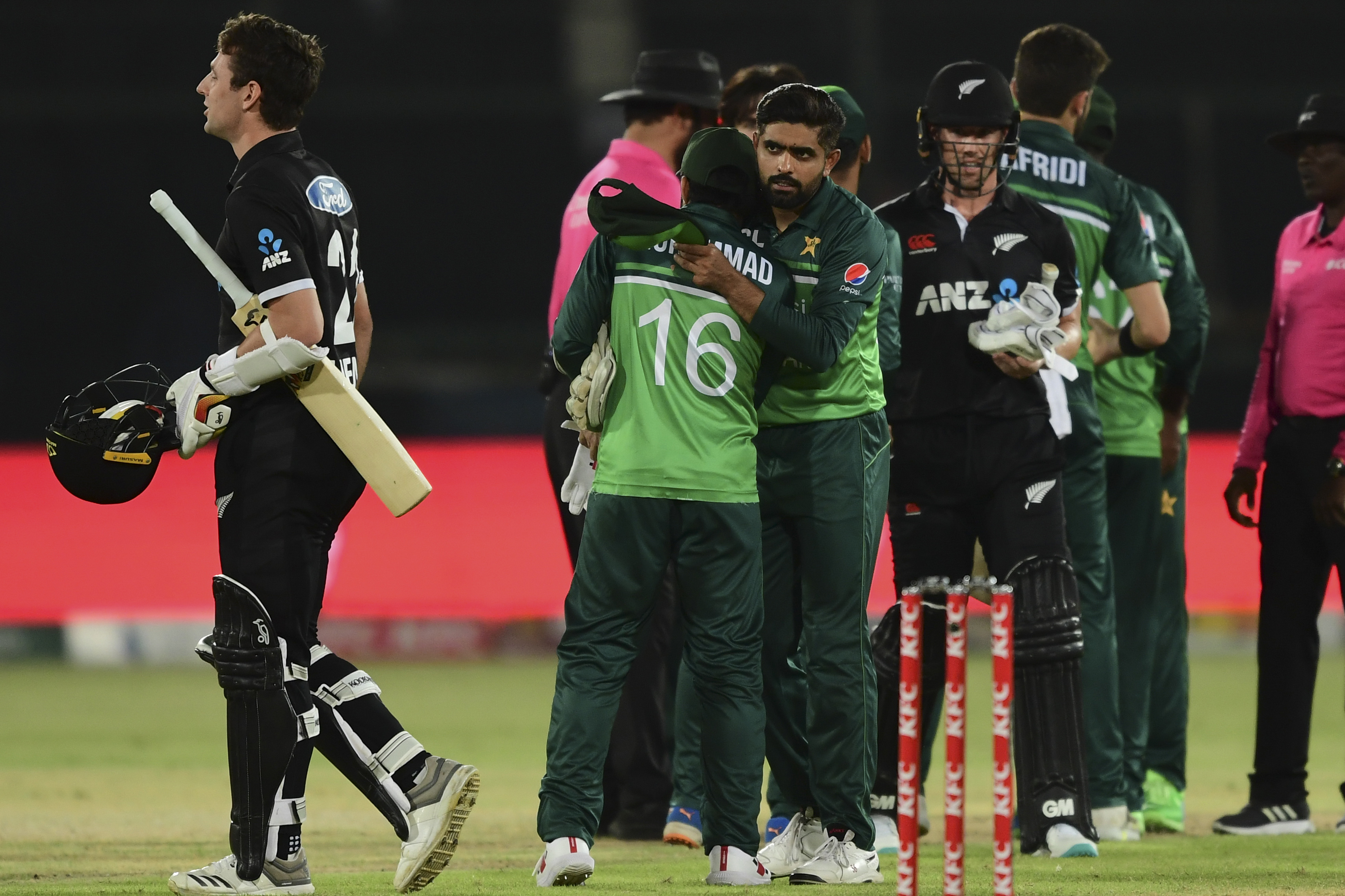 Pakistan's captain Babar Azam and teammates celebrate after winning cricket match against New Zealand.