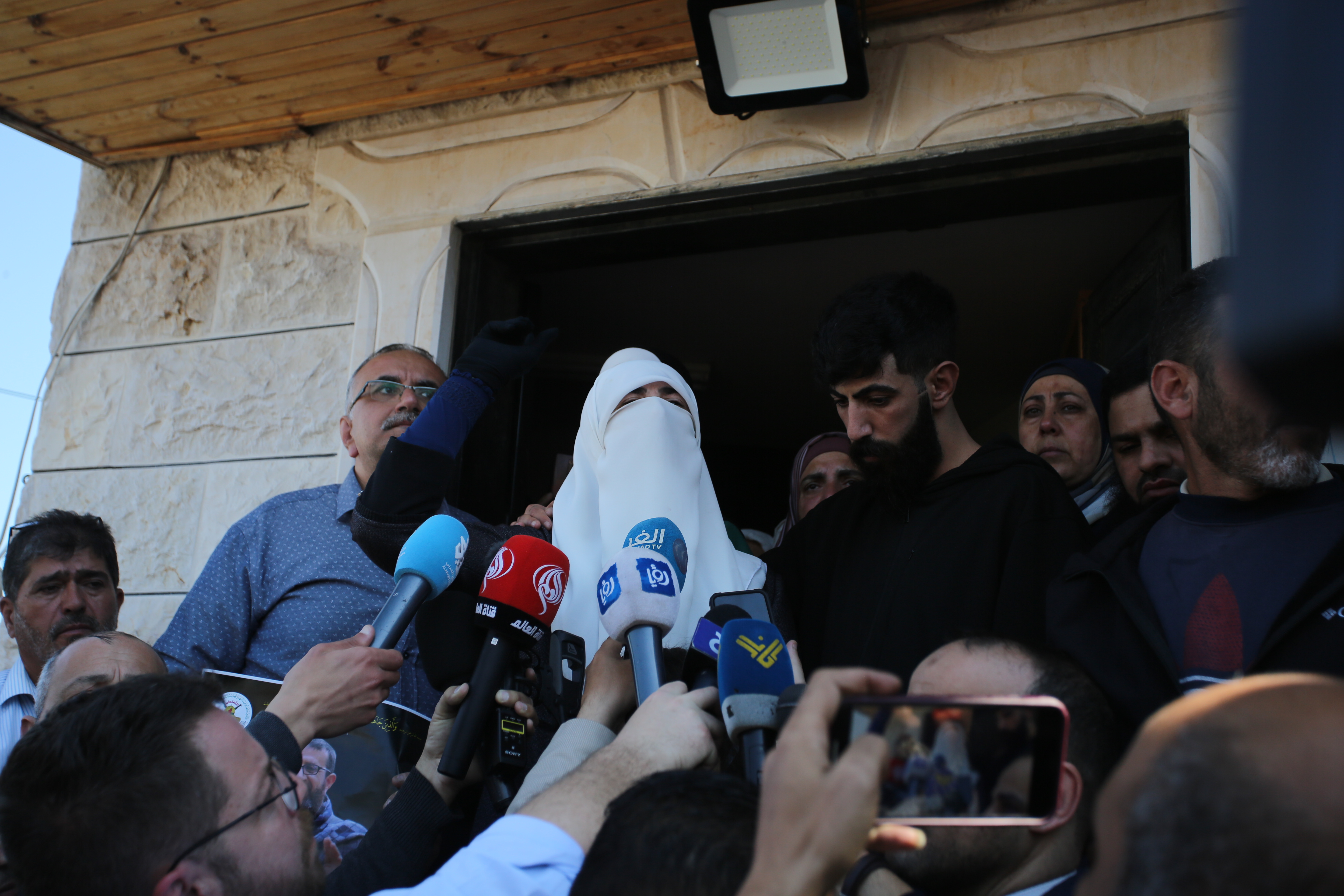 Adnan's wife Randa outside their home in Jenin