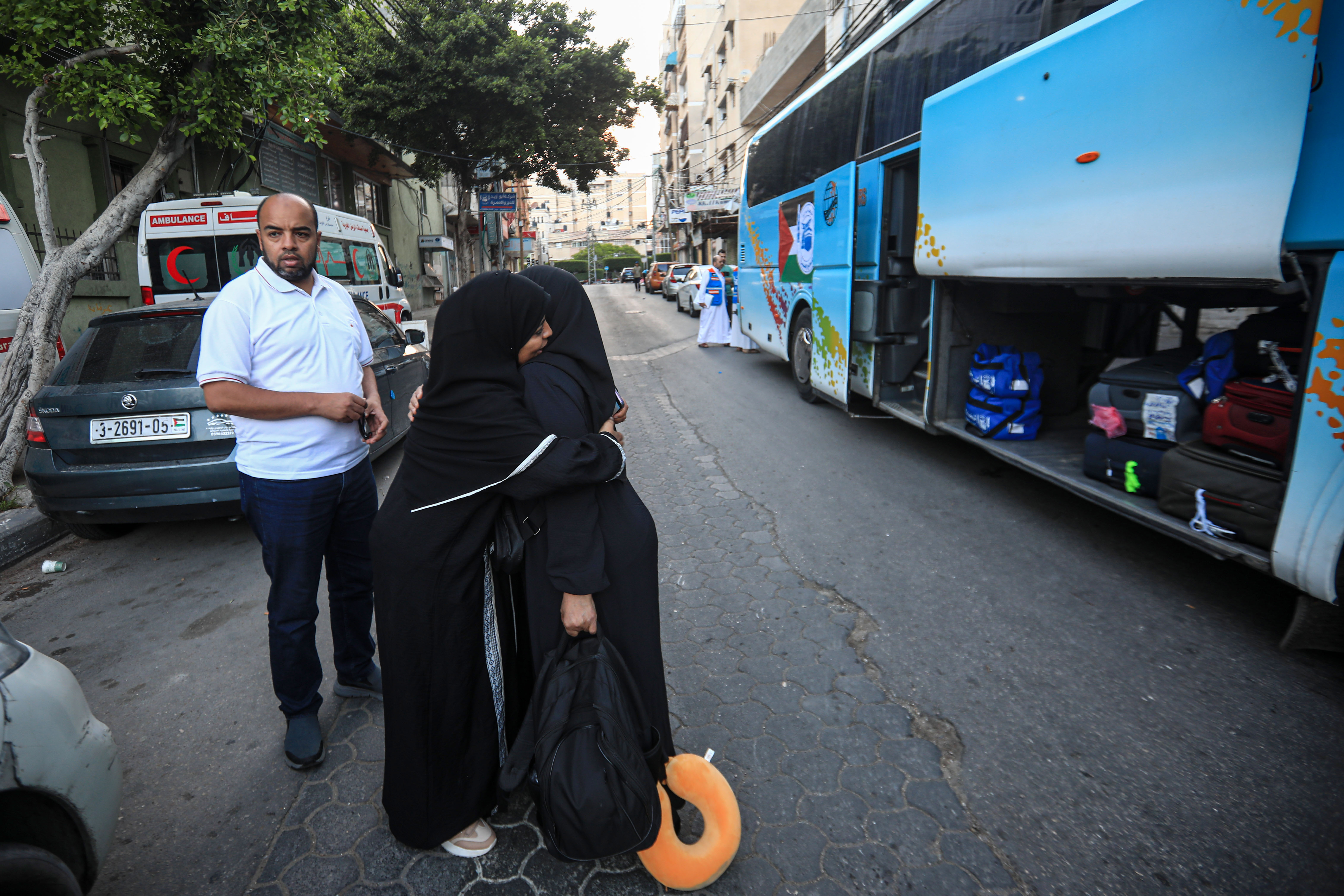 A woman bids farewell to her daughter.