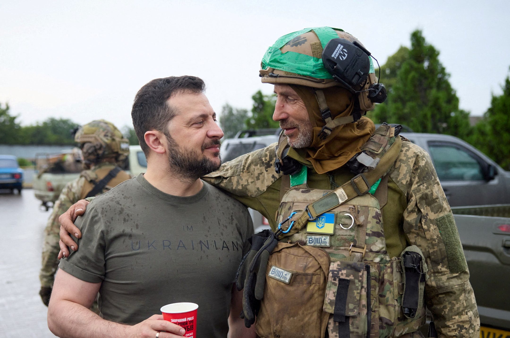Ukraine's President Volodymyr Zelenskiy speaks to a Ukrainian service member at a petrol station after visiting positions near the front line, amid Russia's attack on Ukraine, in Donetsk region, Ukraine June 26, 2023. Ukrainian Presidential Press Service/Handout via REUTERS ATTENTION EDITORS - THIS IMAGE HAS BEEN SUPPLIED BY A THIRD PARTY. TPX IMAGES OF THE DAY
