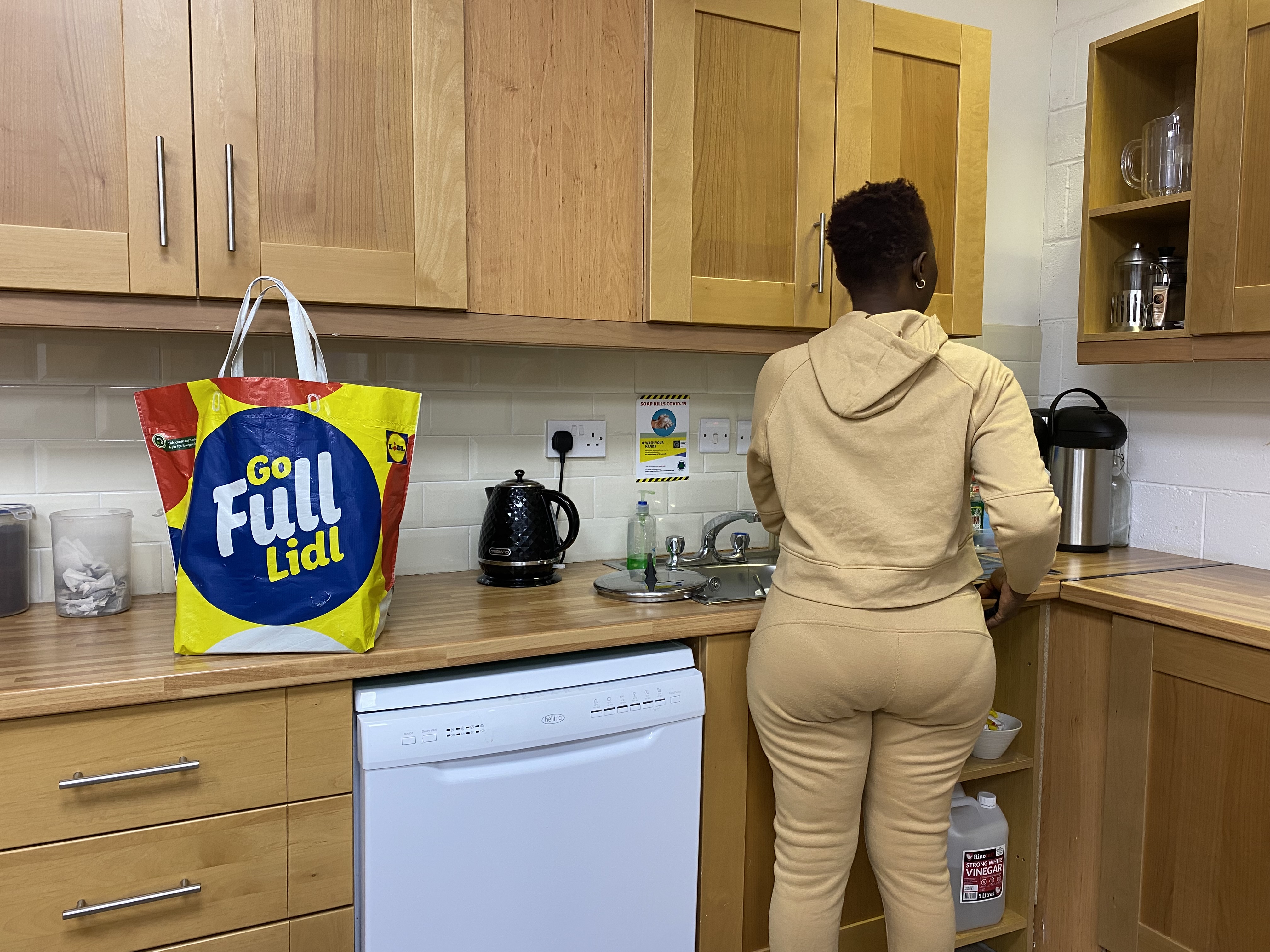 A woman cooks in a kitchen