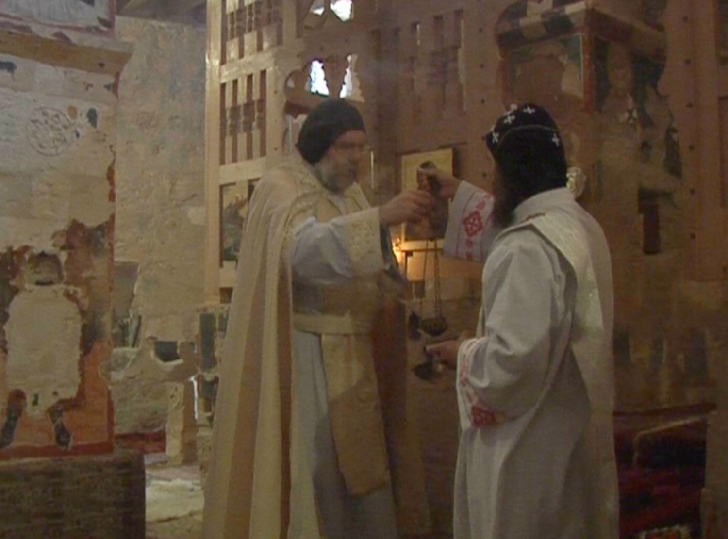 Father Paolo performing a mass